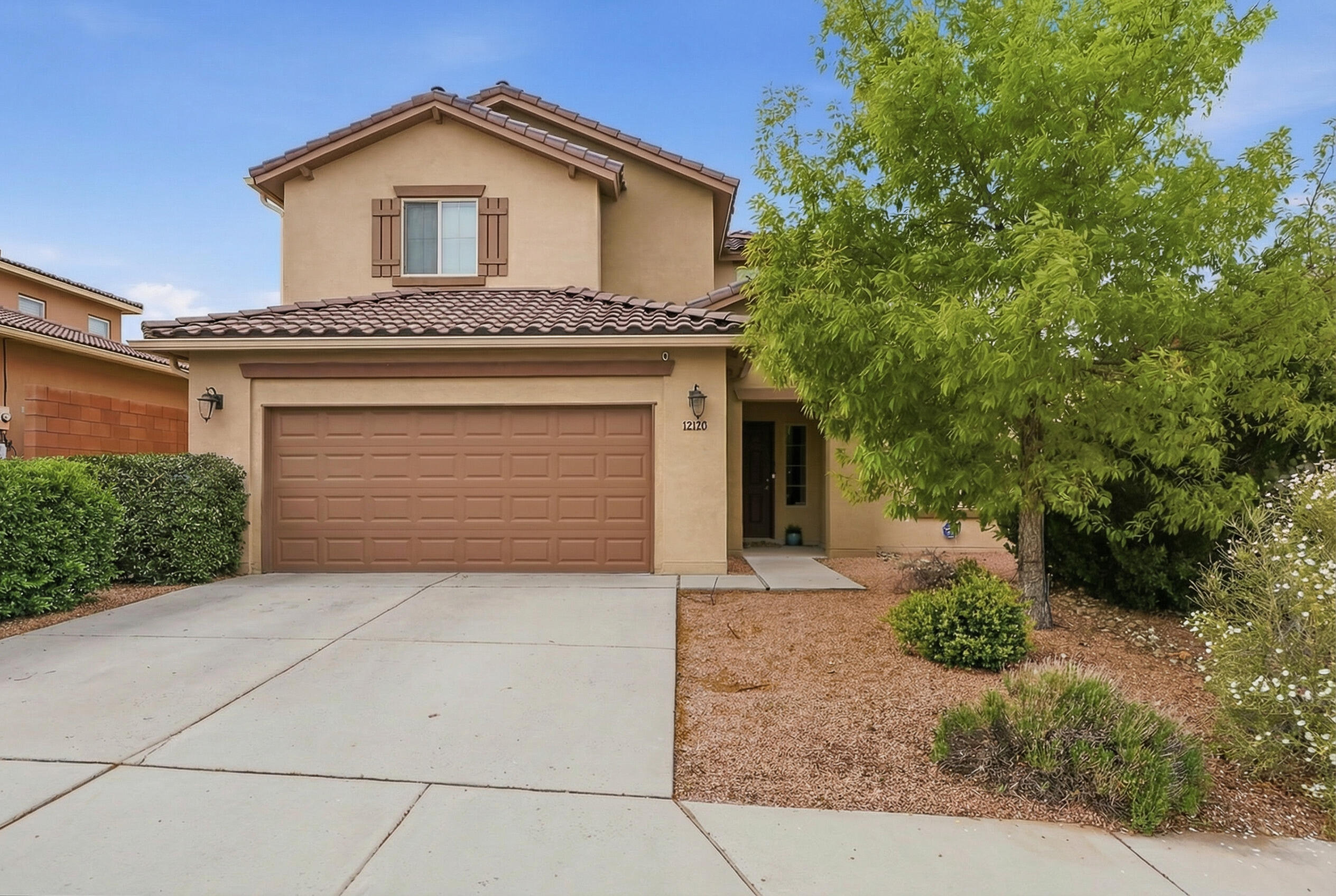 OPEN HOUSE SUNDAY APRIL 19th FROM 1:00PM-3:00PM Beautiful two-story home in Juan Tabo Hills featuring 5 bedrooms and 4 full baths, offering space and flexibility for any lifestyle. The open, bright floor plan is filled with natural light, with a living room showcasing soaring ceilings, large windows, and a cozy fireplace. The kitchen includes ample cabinetry, a large island with breakfast bar, and a walk-in pantry. The main level features both the spacious primary suite with garden tub  plus an additional bedroom and full bath--ideal for guests or multi-generational living. Upstairs offers a loft and additional 3 bedrooms. Neutral colors,  updated tile flooring, new carpet, and new paint.