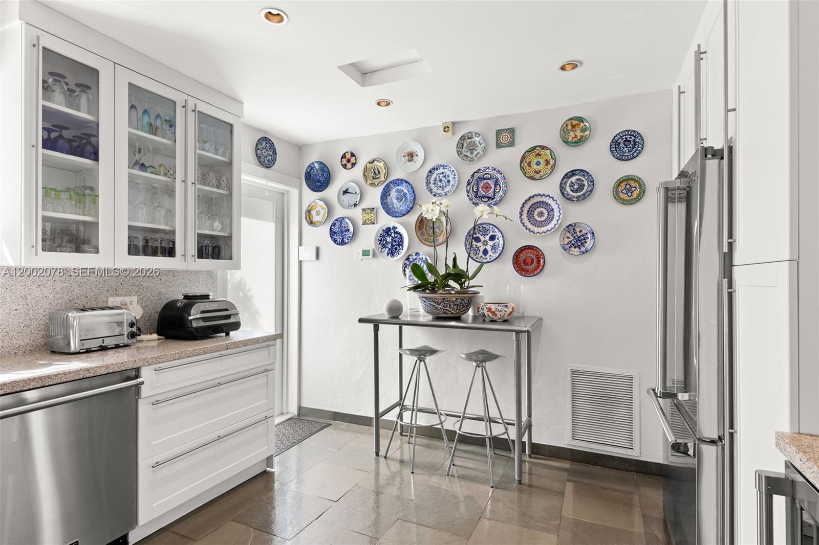 Modern kitchen with designer features at 482 93rd St - Home in Miami Shores