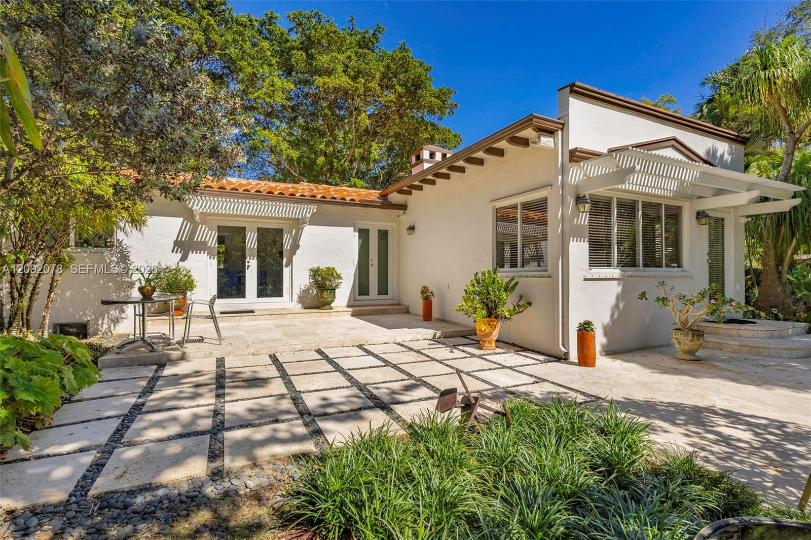 Elegant master bedroom retreat at 482 93rd St - Home in Miami Shores