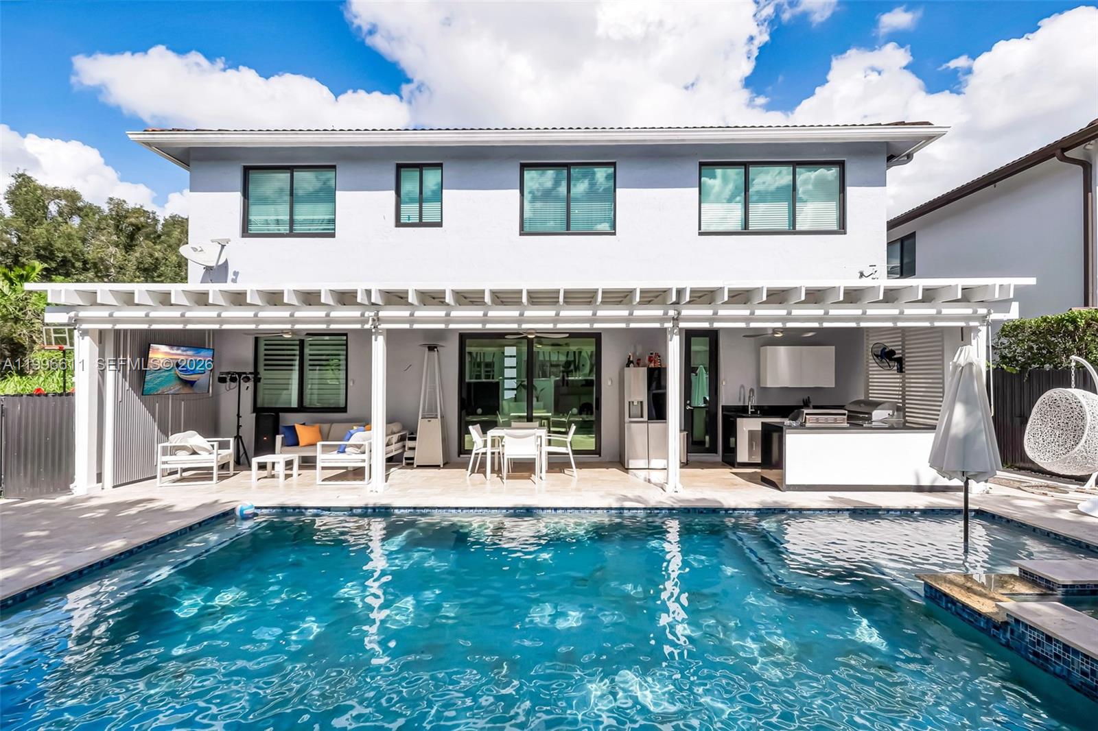 Beautiful two-level property located in one of Miami’s most peaceful and desirable residential areas. This home offers the perfect balance of comfort, functionality, and South Florida lifestyle.Upon entering, you’re welcomed by a bright and spacious layout featuring integrated living and dining areas, seamlessly connected to a functional kitchen and a cozy family room—ideal for everyday living and entertaining. The first floor also includes a bedroom with a full bathroom and direct access to the outdoor area, perfect for guests or added privacy. On the second level, the home offers an excellent layout: a spacious primary suite with a large bathroom featuring a separate shower, soaking tub, double vanity, and two closets. In addition, there are two more bedrooms that share a dual-access bathroom, along with a comfortable sitting area.The outdoor space is one of the property’s standout features, boasting a fully renovated terrace, a pool with a dual water system (saltwater and freshwater), and an electric heater—perfect for year-round enjoyment. It also includes a fully equipped outdoor kitchen with a BBQ area, griddle, and cooktop, complemented by elegant pergolas that create the ideal setting for entertaining.