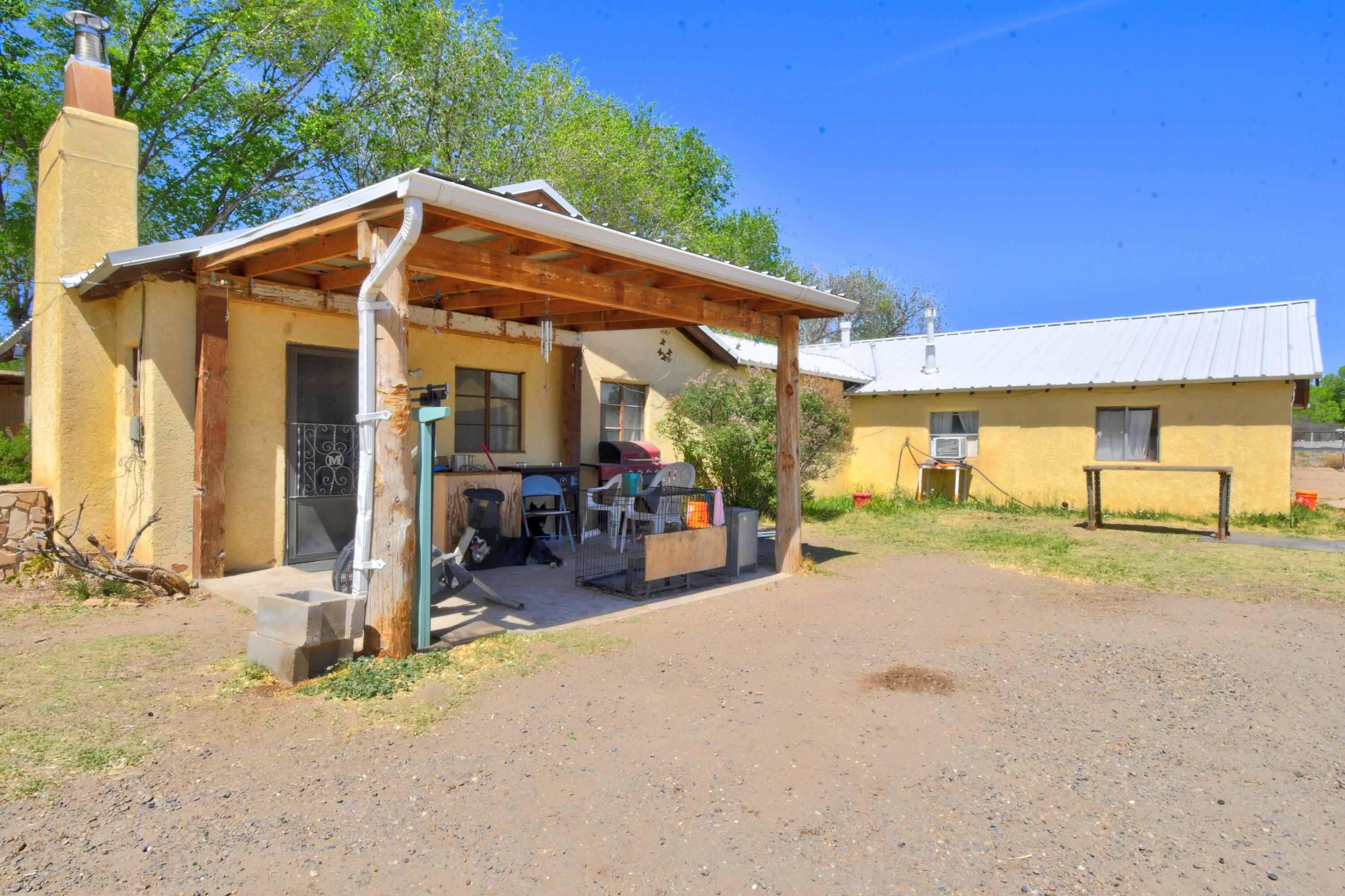 Opportunity awaits in the South Valley! This 3-bedroom, 1-bath home is a true handyman special with endless potential for the right buyer. Equestrian-ready property features a training arena, round pen, corrals, and a tack room/workshop--perfect for horse enthusiasts or hobby farmers. A storage shed and fully fenced lot add functionality and security. Conveniently located with easy access to amenities while still offering room to spread out. Bonus: a partially gutted single-wide conveys as chattel--ideal for storage or future projects. Bring your vision and make this property shine!
