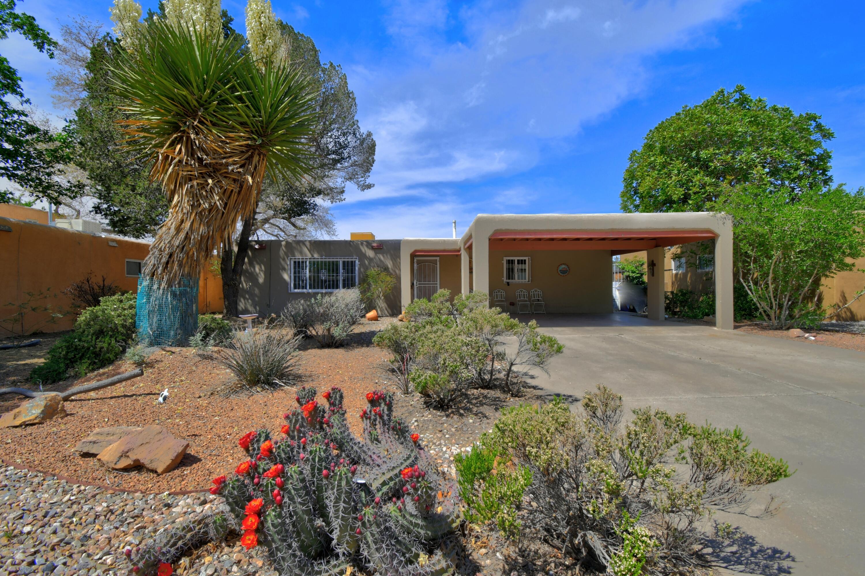 Seller is offering $5000.00 towards buyers' closing costs and pre-paid expenses! Welcome to this long-time, well-loved, 3-bedroom, 2-bathroom, 2-car garage home under 300k located in an area that has so much to offer. The most recent additions to this property include: TPO roof on main structure, shingles on garage, flooring, paint, a gazebo, and kitchen appliances. In the front of the house, you'll find a fully built 2-car carport, sitting next to some beautiful and easy-to-maintain New Mexican landscaping. The backyard offers alley access that leads to an extra tall 2-car garage! This garage is the dream situation for the handy type person. This is a fantastic house that's ready to move into.