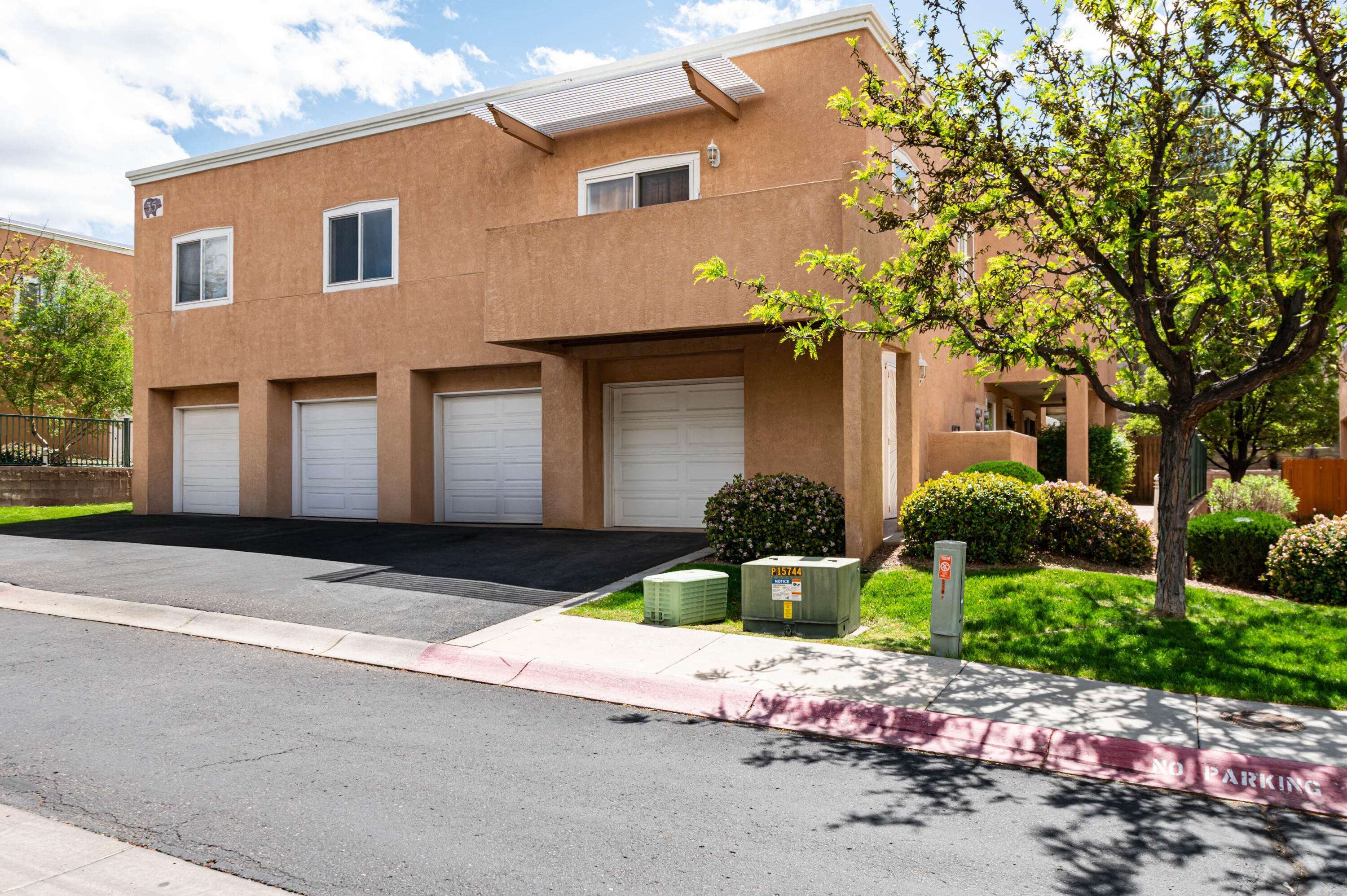 Inviting and thoughtfully designed, this 3-bedroom, 2-story condo in sought-after Oso Park Condominiums offers comfort and style in a gated community. Enjoy upgraded refrigerated air, an attached 1-car garage, and a layout that lives beautifully. Warm wood floors guide you through the home, leading to a cozy gas log fireplace and a private patio perfect for quiet mornings or relaxed evenings. The kitchen and baths shine with upgraded granite counters throughout. A hard-to-find floor plan with modern touches, perfectly suited for easy living in Northwest Albuquerque.