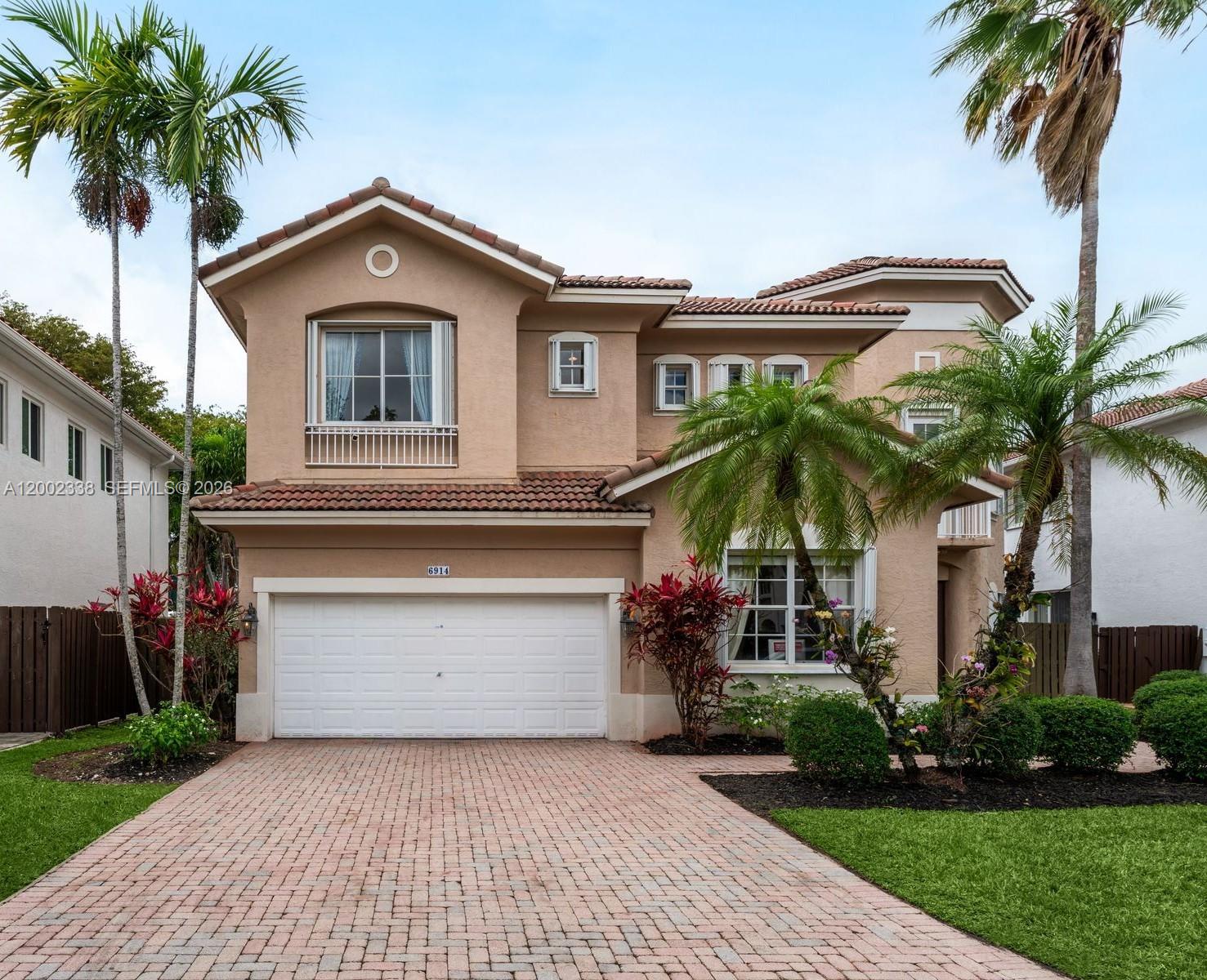 Enjoy Doral Isle resort living style in this spectacular MEDITERRANEAN 2-story home. Great floor plan w/ foyer entrance, volume ceilings, tile floor & 2 bed/2bath on 1st floor. Open kitchen w/ breakfast area is adjacent to family rm overlooking garden, pool & backyard.  Home is bright filled w/ natural light, formal dining rm & high ceilings living rm.  Oversized master suite w/ double sink, separate shower, jacuzzi & spacious walk-in closets. The other 3 bedrooms are upstairs w/ an additional study area. Doral Isle amenities include clubhouse w/ 3 pools w/ waterfalls, lakefront fitness center, lighted tennis courts, spinning rm, soccer field, basketball courts, beach volleyball, sauna, kids’ playground & poolside café. Minutes from top-rated golf courses, shopping, dining & major highways.