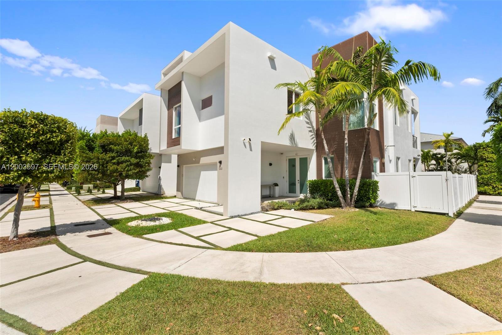Exceptional opportunity to own a stunning 5-bedroom, 4.5-bath residence on a premium corner lot within an exclusive gated community of only 59 homes with 24-hour security. This elegant home showcases high-end finishes throughout, including a sleek Italian kitchen equipped with Sub-Zero appliances, and a fully integrated smart home system with security cameras and built-in audio in key living areas. Designed for both comfort and entertaining, the spacious outdoor area features a private pool and summer kitchen. Generous driveway accommodates up to three vehicles. Currently undergoing tasteful upgrades in the kitchen, family room, and cabana bath, further enhancing its modern appeal and overall value. A rare opportunity to own in one of Doral’s most desirable communities.