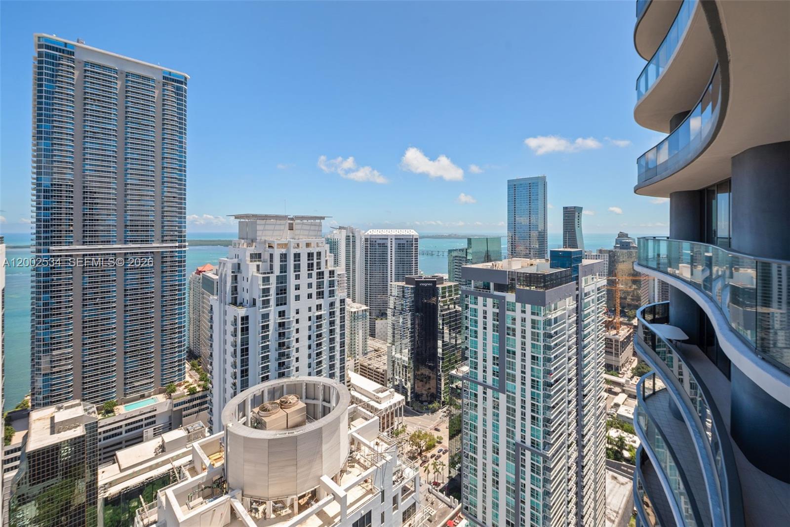 Experience luxury living in this stunning penthouse at Brickell Flatiron, one of the newest developments by Ugo Colombo. Enjoy convenient access to Mary Brickell Village and Brickell City Centre for shopping and dining. PH 5103 boasts breathtaking panoramic bay and skyline views through 10ft floor-to-ceiling windows. Revel in Italian porcelain tile flooring by Casalgreande Padana and a European-style kitchen by Snaidero with Miele appliances. Indulge in the 64th floor "Sky Club" amenities, including a fitness center, pool with sunrise to sunset views, and spa. Additional building amenities include a club room, lounge, children’s playroom, 18th floor lap pool, billiards room, and movie theater. Discover unparalleled luxury at Brickell Flatiron!