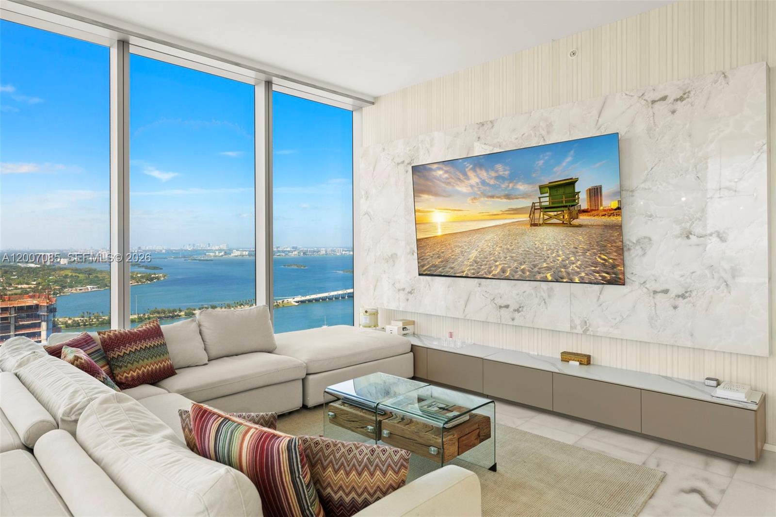 Authentic Missoni residence! Fully furnished 2-bedroom, 2-bathroom NW corner unit on the 42nd floor of Missoni Baia, with Biscayne Bay and city views. Floor-to-ceiling 10-foot windows, marble floors, and Missoni furnishings and finishes throughout — including Missoni wallpaper, chairs, and textiles — deliver the full Missoni aesthetic and lifestyle directly into your home. The Italkraft kitchen comes fully equipped with Wolf and Subzero appliances and a wine cooler. Hidden-hinge doors and frameless hallway doors create a clean, seamless interior. The residence opens to a spacious balcony with panoramic city views. Custom storage added throughout: built-in cabinetry in the hallway, linen closet, medicine cabinets, additional shelving in bathrooms, and more. Both bedrooms offer en-suite baths, with the master featuring a double-sink bathroom and a walk-in closet. Residents enjoy resort-style amenities, including an infinity-edge pool, spa, fitness center, social lounge, game room, tennis court, and much more. Located in Edgewater with direct access to The Design District, Wynwood, Brickell, Miami Beach, and Miami International Airport.