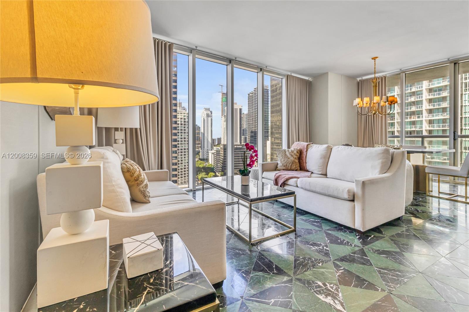 Located in the heart of Brickell, steps from Brickell City Centre and Mary Brickell Village, this 2BR/2BA corner unit at ICON Brickell Tower 3 offers stunning bay, river, ocean, and skyline views from the 25th floor. Floor-to-ceiling glass and a private balcony fill the space with natural light. Open living/dining area, modern kitchen with wood cabinetry, panel-ready refrigerator, and built-in appliances. Spacious primary suite with spa-style bath, soaking tub, and glass shower. Fully furnished and turnkey move-in or rent immediately. Short-term rentals allowed (Airbnb-friendly), ideal for investors or second home. Resort-style amenities include a 300-ft pool, spa, and 28,000 SF fitness center.
