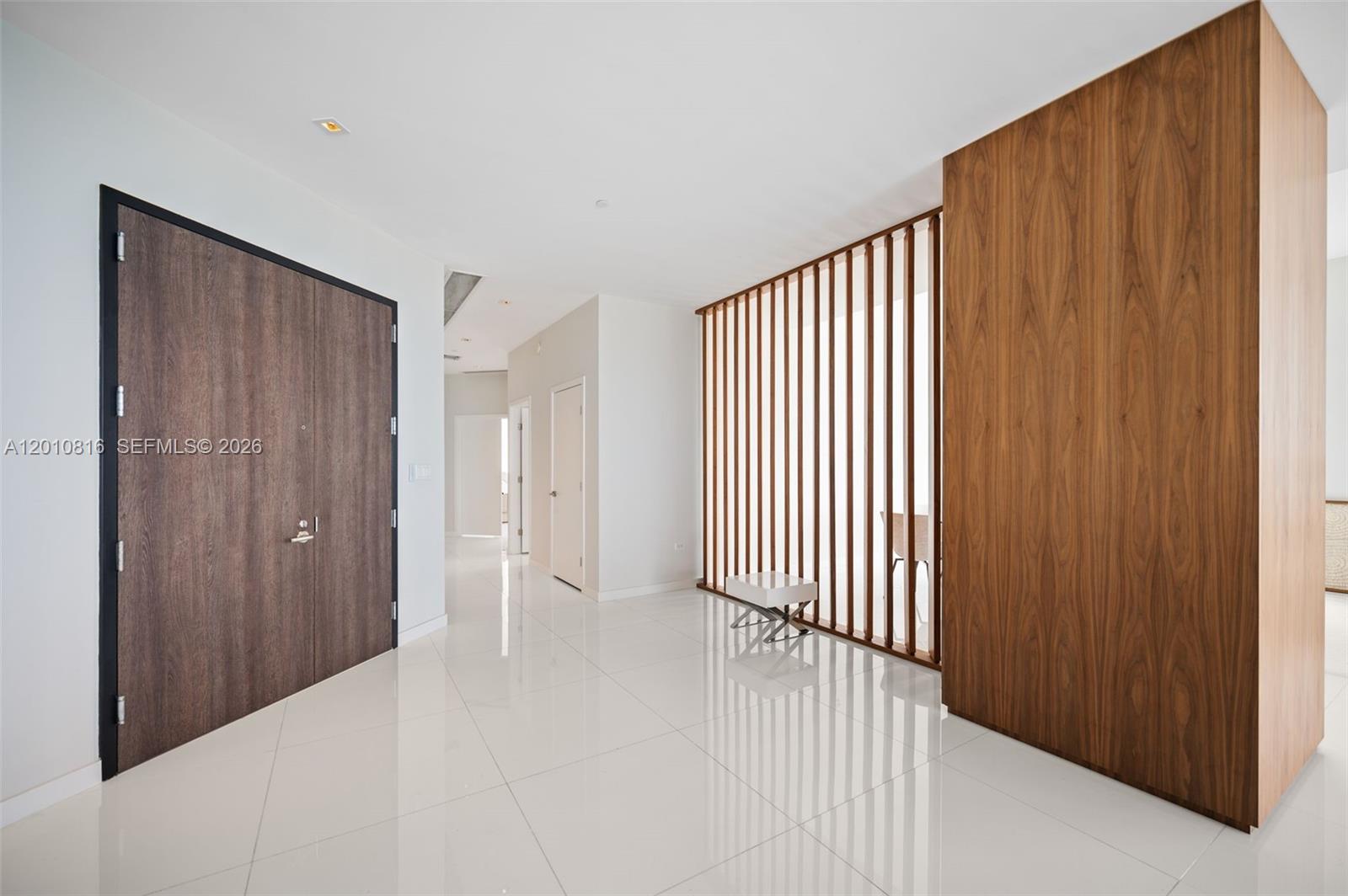 This is not just a residence—it is a statement penthouse at Rise, Brickell City Centre, where scale, design, and location converge to create a truly rare offering. Encompassing 4 bedrooms plus an enlarged den and 5.5 bathrooms, this exceptional corner home with 11' ceilings is defined by its grand proportions and uninterrupted water and city views, showcased from an extraordinary 1,035 square feet of wraparound balconies. Every detail has been curated for a refined, elevated lifestyle. Elegant porcelain flooring flows throughout, complemented by bespoke Italian cabinetry and a striking quartz island kitchen designed for both entertaining and everyday living. Spa-caliber bathrooms with sleek vanities and integrated automated shades add a layer of modern sophistication. Each bedroom is a private retreat with generous walk-in closets, while a full laundry room and separate staff’s quarters with a full bath provide seamless functionality without compromising discretion. With three assigned parking spaces convenience is effortlessly integrated into this distinguished home. Positioned above Brickell’s most prestigious destination for luxury shopping and dining, this penthouse represents a rare opportunity to own one of the most significant residences in the building and Brickell.