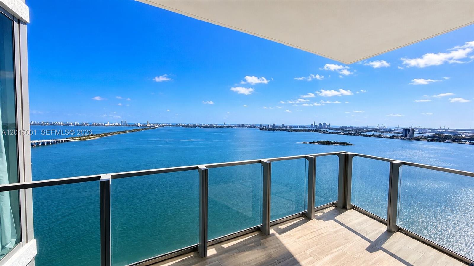 Perched on the 32nd floor of Biscayne Beach, this exceptional southeast corner residence offers panoramic bay and skyline views paired with refined contemporary design. Arrive via private elevator foyer into a light-filled 3-bedroom, 4-bathroom residence featuring floor-to-ceiling glass, elegant herringbone flooring, and expansive indoor-outdoor living spaces. The designer kitchen showcases premium Miele appliances and sleek Snaidero cabinetry, while the spa-inspired primary suite delivers a luxurious retreat above the Miami skyline. Biscayne Beach residents enjoy world-class amenities designed by Thom Filicia, including resort-style pools, beach club, tennis courts, valet, fitness center, and curated social spaces in one of Miami’s most desirable waterfront addresses.