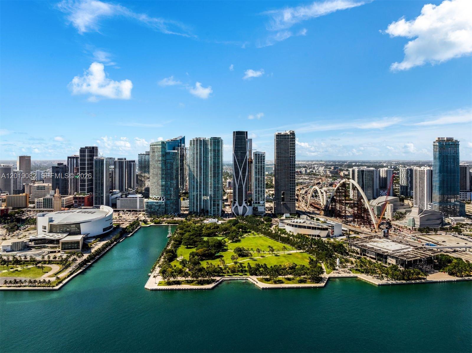 Experience the pinnacle of ultraluxury living in this full-floor penthouse at One Thousand Museum, Zaha Hadid’s iconic architectural masterpiece. This rare 51st-floor sky mansion spans 10,338 SF interior plus 1,200 SF terraces, delivering breathtaking 360-degree views of Biscayne Bay, Miami Beach, the Atlantic Ocean, and the Downtown Miami skyline. The residence offers 6 bedrooms, 6.5 bathrooms, a dramatic great room with custom bar, chef’s kitchen with premium appliances and butler’s pantry, private movie theater, family/media room, his-and-hers closets and baths in the primary suite, motorized shades, integrated AV system, and exceptional designer finishes throughout. Residents enjoy world-class building amenities including a private rooftop helipad, sky lounge, indoor/outdoor fitness centers, full-service spa, aquatic center, and white-glove concierge.