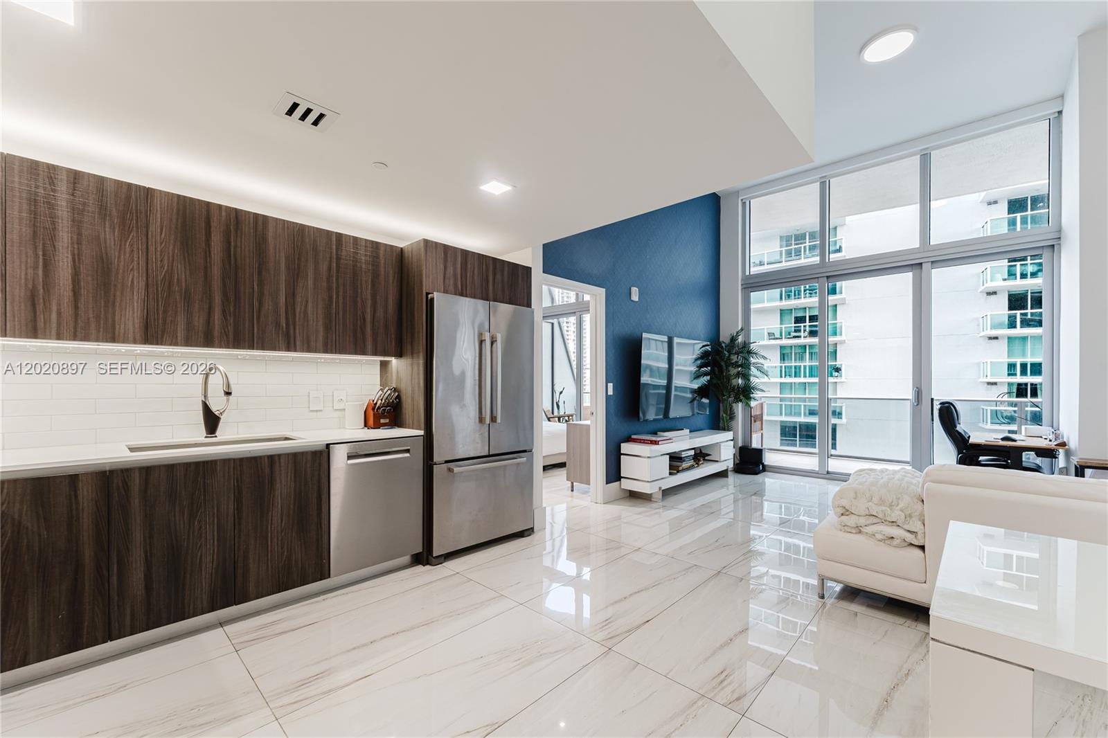 Centrally located in the Arts and Entertainment District with waterfront views and finished with luxurious details at the coveted Aria on the Bay, we proudly bring you unit 1205. This spacious one bed, 1 bath condo boasts desirability on all fronts from a central location with close proximity to highways, various neighborhoods in the City of Miami, picturesque ocean and bay front views, shopping and dining all while maintaining a calm and quiet community feel. Interior features of this unit include: 14 foot vaulted ceilings throughout, recessed lighting, fresh paint and wallpaper accent walls, mechanical blinds, upgraded porcelain floors throughout the unit, quartz countertops, Bosch stainless appliances and a protected view of Biscayne Bay. Come and see all this unit offers today!