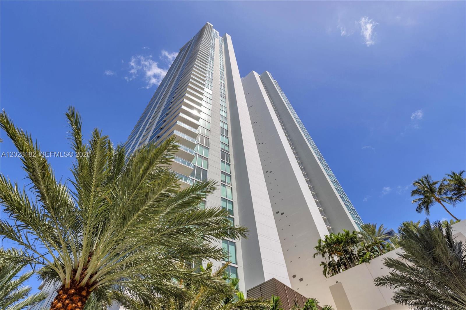 Enjoy a unique waterfront lifestyle in this 3BR/4BA NE corner residence. The 4th floor location offers a rare cruise ship perspective with breathtaking bay views, passing yatchs, and frequent dolphin sightseeings. A private elevator foyer opens to floor to ceiling glass, luxurious designer wallpaper, high end furnishings, expansive terraces, a gourmet kitchen with Miele appliances and snaidero cabinetry, and spa inspired suite. Residents enjoy resort style pools, beach club, tennis courts, fitness center, valet, concierge, and are within walking distance of the Miami Design District.