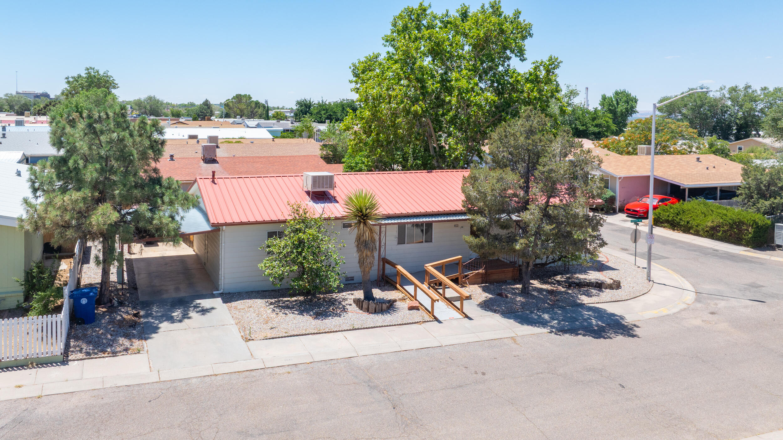 Welcome to Sun North Estates! This quaint, corner lot built in the early 1970's is conveniently located right off the I-25 and Alameda exit and within a mile of balloon fiesta park and the Journal Center! Well maintained (interior and exterior) with 2 bedrooms and 2 full bathrooms. Features 2 living areas, sunroom, and proportional backyard with a brand new fence. Has an HOA that covers common areas, has a community swimming pool and clubhouse with amenities. Don't miss this opportunity! Schedule a time to tour!