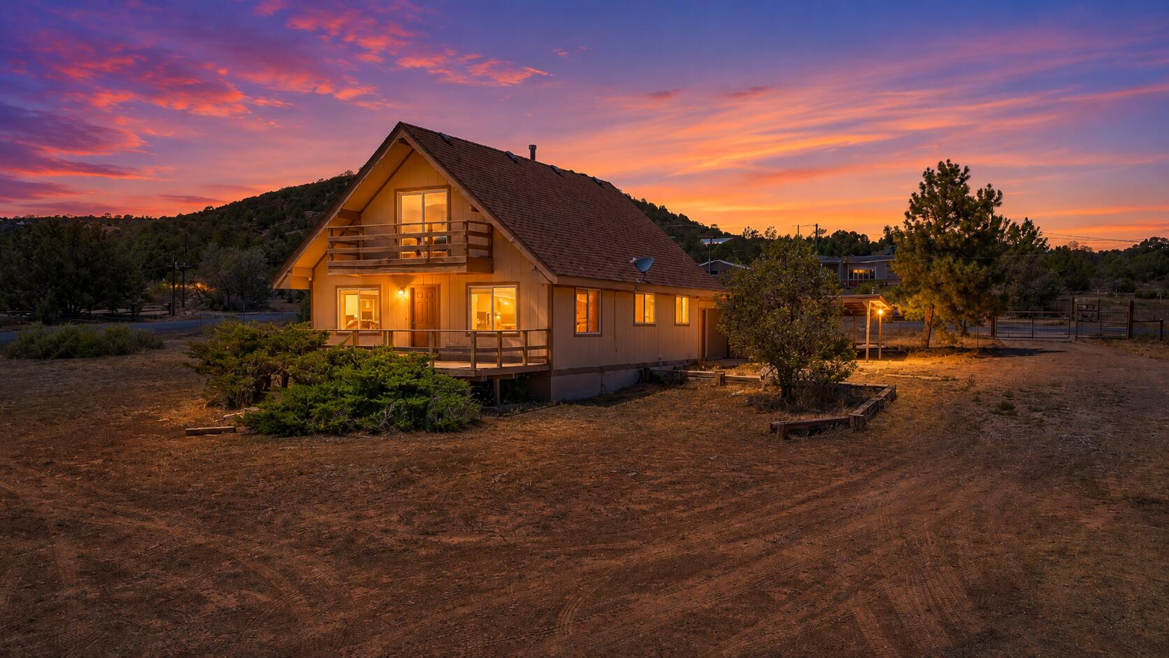 Escape to the beauty of the East Mountains with this charming A-frame-inspired home on a  1-acre lot. The floor plan offers large living spaces, tons of storage options, plus a bedroom downstairs.  The acre lot provides endless possibilities for gardening, a workshop, horses, or simply enjoying the peaceful setting. Whether you're looking for a full-time residence, weekend retreat, or investment opportunity, this property captures the rustic charm and tranquility that make East Mountain homes so desirable. Just a short drive to Albuquerque.