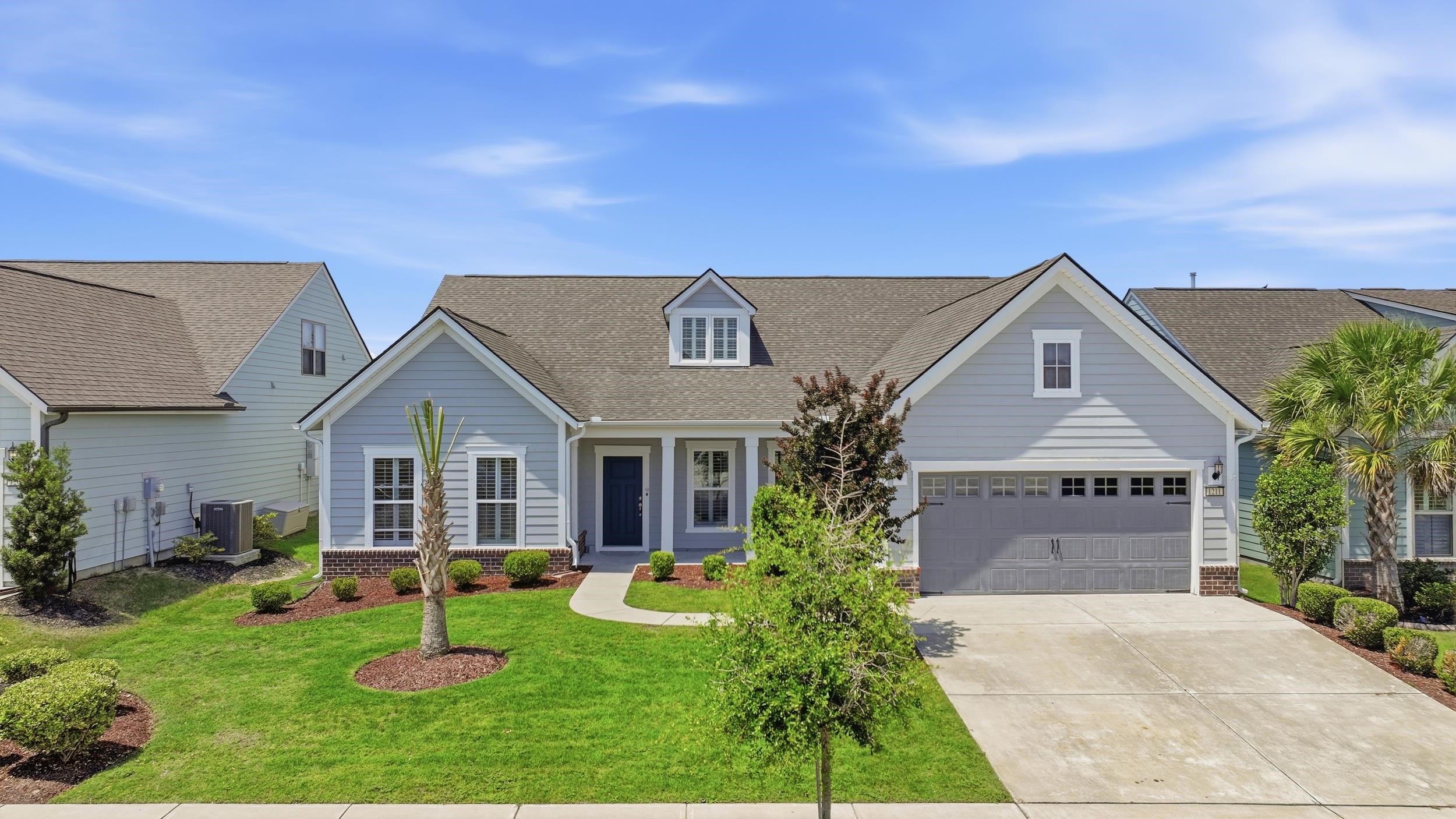 Some homes check the boxes. Others change the way you imagine living. This is one of those homes.  As the ONLY Tangerly Oak currently available in Del Webb at Grande Dunes, this residence offers a rare opportunity to own one of the community’s largest and most sought after floor plans in Myrtle Beach’s premier active adult community. Offering over 3,800 heated square feet, every detail was thoughtfully considered to make everyday living feel effortless while offering plenty of room to entertain family and friends.  Start your mornings in the light filled sunroom overlooking a peaceful pond view. From quiet mornings with coffee to holiday dinners shared around the table, this home was designed for the moments that matter most.  At the heart of the home is a beautifully appointed chef’s kitchen featuring granite countertops, stainless steel appliances, a Smart Refrigerator, an oversized island, a walk in pantry and abundant workspace that makes everything from entertaining to everyday meals a pleasure. Plantation shutters throughout, Craftsman style trim and molding, rich hardwood floors, custom built ins, and a gas fireplace add warmth, character, and timeless appeal throughout the home.  The private primary suite serves as a relaxing retreat with dual vanities, a soaking tub, an oversized walk in shower, and an impressive custom walk in closet. An additional bedroom on the main level provides comfortable accommodations for family or guests, while the dedicated office offers an ideal work from home space or den. Upstairs, a spacious bonus suite with its own full bath and generous storage room creates endless possibilities as a guest retreat, hobby room, media room, or additional living space.  Additional highlights include custom closet systems, a spacious laundry room with direct access to the primary suite, an oversized two car garage, and thoughtful upgrades throughout that make this home truly move in ready.  Del Webb at Grande Dunes offers an unmatched coastal lifestyle with exceptional amenities designed for active living. Residents enjoy a spectacular resort style pool overlooking the Intracoastal Waterway, an indoor pool, state of the art fitness center, pickleball and tennis courts, bocce, a full time Lifestyle Director, and a vibrant calendar of social events. Homeowners also enjoy exclusive access to the private Grande Dunes Ocean Club featuring oceanfront dining, an Olympic size pool with food and beverage service, along with the many amenities that make Grande Dunes one of Myrtle Beach’s most prestigious communities, including championship golf courses, a deep water marina, miles of walking and biking trails, and outstanding dining. Come experience the lifestyle that has made Del Webb at Grande Dunes one of the most sought after communities along the Grand Strand. Schedule your private showing today!