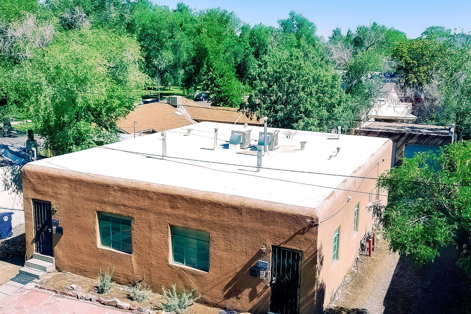 Duplex directly across from Roosevelt Park! Grea1407 & 1409 Hazeldine SE offer 1BR/1BA units w/refrig & gas range in each. 1 Garage space for each unit. Spacious backyard for common space. Original hardwood floors in both units. New TPO roof in 2024. Upgraded Electric panel. 1407 incls small priv enclosed yd, lath/plaster walls, vinyl flrs in kit/service area to backyard, tile tub surround & 2 wall heat units. 1409 incls 2 nat gas wall furnaces, BR carpet, wood-look vinyl in kit/bath, cultured marble tub surround & W hookups. Both units feature a flex space area. New TPO roof 2024. Backyard access to det garage/parking area, w/shared common yd space w/mature trees & garden potential. Great rental/investment/owner occupant opportunity near park amenities playgrounds & downtown/UNM access.