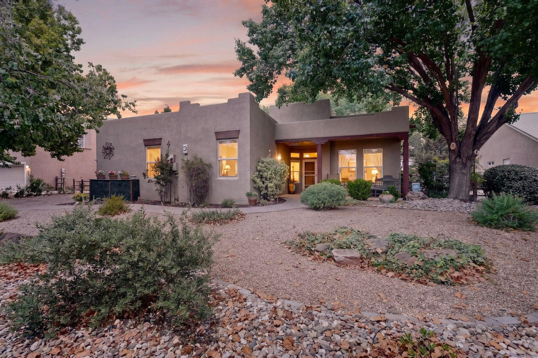 Beautiful 4-bedroom home in the highly desirable Bosque Del Rio Subdivision! This thoughtfully designed single-story home offers an open, light-filled floor plan with soaring ceilings, attractive architectural details, and nichos throughout that add classic Southwestern charm.The spacious gourmet kitchen features granite countertops, stainless steel appliances, abundant cabinetry, a large center island with seating, and opens seamlessly to the great room with a stunning gas fireplace--perfect for entertaining family and friends.The private owner's suite is a relaxing retreat with a walk-in shower, dual vanities, and generous walk-in closet. Three additional bedrooms provide flexibility for family, guests, or a home office.Step outside to your own backyard oasis featuring lush g