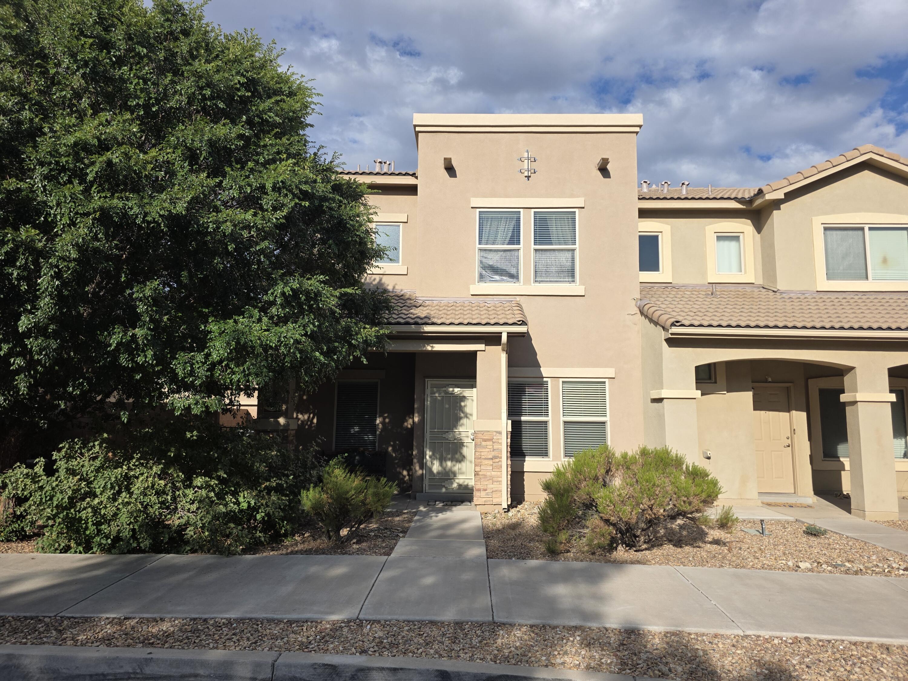 GATED COMMUNITY!! Wonderfully maintained townhome located in the well-maintained and coveted Presidio community, w/clubhouse and fitness center. This multi-level home is in GREAT condition and comes with a nice open floor plan and is equipped with all the bells and whistles. Includes: open kitchen w/STAINLESS STEEL APPLIANCES, GRANITE COUNTERS, breakfast bar, recessed lighting and ceramic tile backsplash, large living area w/clerestory ceilings, REFRIGERATED AIR, NEWER Tile Roof, separate upstairs office space and service room, spacious master bath w/cultured marble surround and LARGE walk-in closet, side yard w/open brick patio and easy maintenance Astro Turf.  Enjoy easy access to public transportation and within walking distance to schools, dining and shopping.  An absolute MUST SEE...