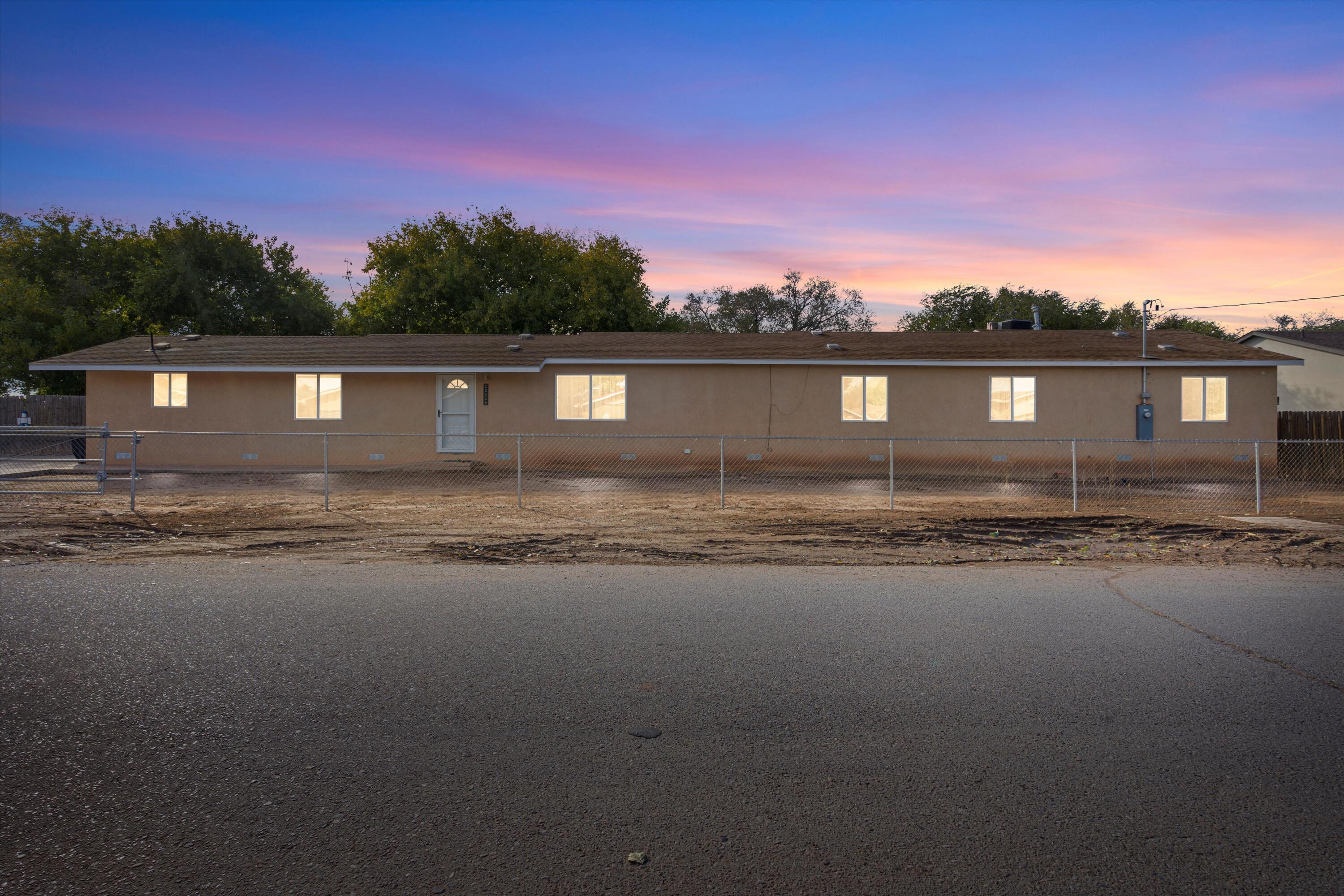 NOT A MOBILE HOME. SPACIOUS LIVING WITH ENDLESS POSSIBILITIES! This stunning FRAME BUILT Southwest Albuquerque home features a large open floor plan combining the Great Room, dining area, and kitchen, perfect for gatherings. With 3 bedrooms and 2 baths, it suits a variety of lifestyles. The outdoor space is a blank canvas for your creativity. Situated in a quiet, welcoming neighborhood, this property offers a fenced yard, a generous driveway, and storage space with room for an RV or toys. Don't miss the chance to make this versatile home yours! Call today for a private tour!