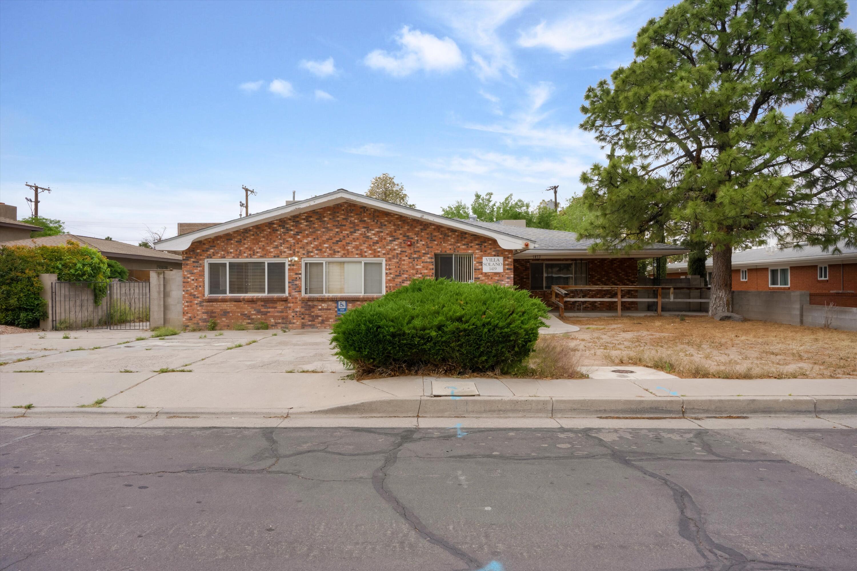 Currently a residential assisted living facility in the UNM area! This expansive 1961 ranch-style home boasts 8 bedrooms across 3,502 sq ft of living space, perfectly configured as a residential assisted living facility. Situated on just under a quarter-acre lot with a private backyard, open patio, and a comfortable finished sunroom. Modern utilities include, forced air heat, tile floors, and essential appliances. Excellent accessibility features make it resident-friendly. Conveniently located near UNM with quick access to major corridors, schools, and amenities.