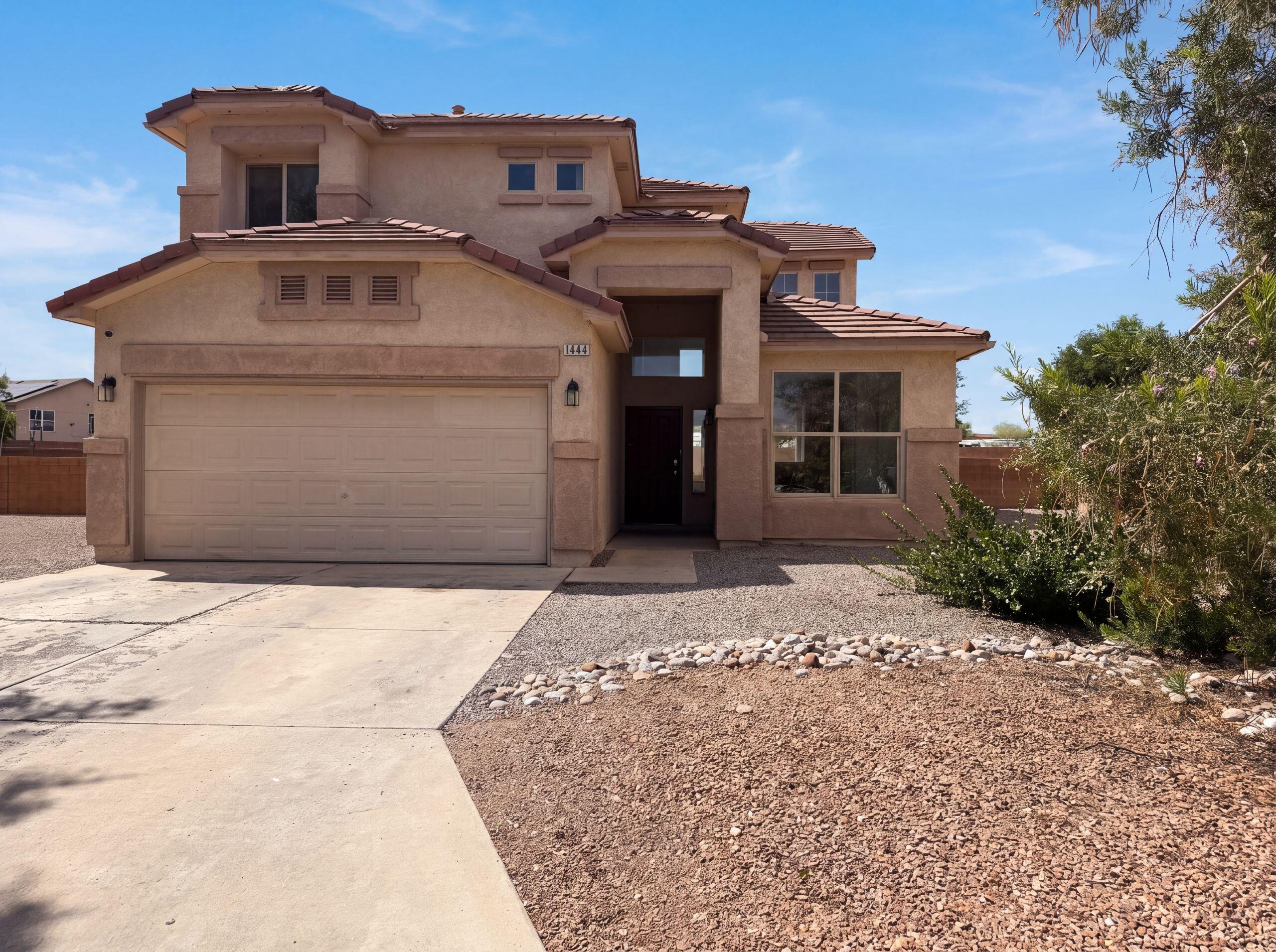 Welcome to 1444 Peppoli Loop SE, a residence recently enhanced with fresh interior paint and partial flooring replacement throughout. The kitchen features all stainless steel appliances, while a welcoming fireplace provides a central point for gathering. The primary bathroom contains double sinks and a separate tub and shower for practical use. Outside, a patio in the back yard provides an ideal space for outdoor enjoyment. Experience modern comfort and practicality in this appealing residence.. Included 100-Day Home Warranty with buyer activation