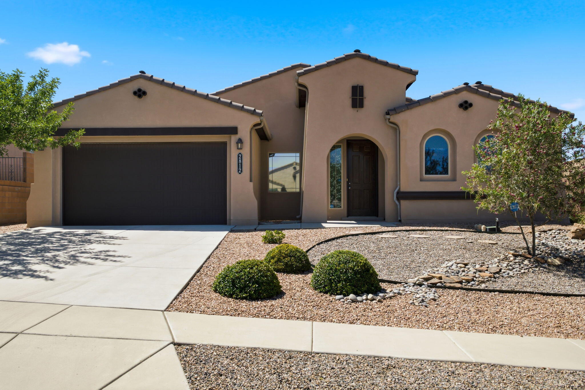 Welcome home to this beautifully maintained, single-owner DR Horton home in the highly desirable Arbolera De Estate in the master-planned Cabezon community. This popular single-story floor plan offers four spacious bedrooms with a thoughtful split-bedroom design, providing added privacy for the primary suite. The open-concept living area is perfect for everyday living and entertaining, complemented by a formal dining room for special gatherings. The generously sized primary suite features a large walk-in closet and is tucked away from the secondary bedrooms for a peaceful retreat. Step outside to enjoy the covered patio and low-maintenance desert landscaped backyard, offering the perfect space to relax without the upkeep. Enjoy the benefits of Cabezon with numerous parks, community pool, community center, sports fields and more. With its functional layout, pride of ownership, and sought-after location, this home is one you don't want to miss.