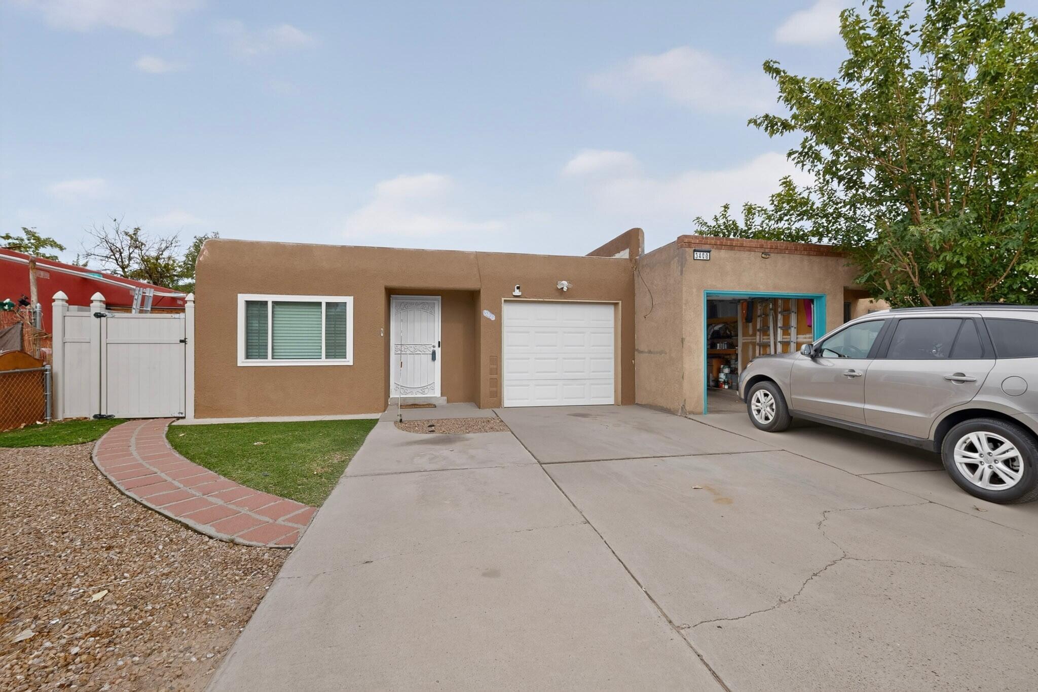 Move-in ready and full of potential, this charming two-bedroom, two-bathroom home offers a comfortable and functional layout with plenty of flexibility. Inside, you'll find inviting living spaces, a versatile den, an updated kitchen and appliances, and a combination of wood and tile flooring that adds warmth and character throughout. An attached one-car garage provides additional convenience, while recent exterior paint adds to the home's curb appeal.Ideally located with quick access to I-40, shopping, dining, and everyday amenities, this home makes getting around Albuquerque a breeze. Best of all, there's no HOA! Furniture is negotiable, offering even more flexibility for the next owner. Don't miss this well-located, move-in-ready opportunity--schedule your showing today!