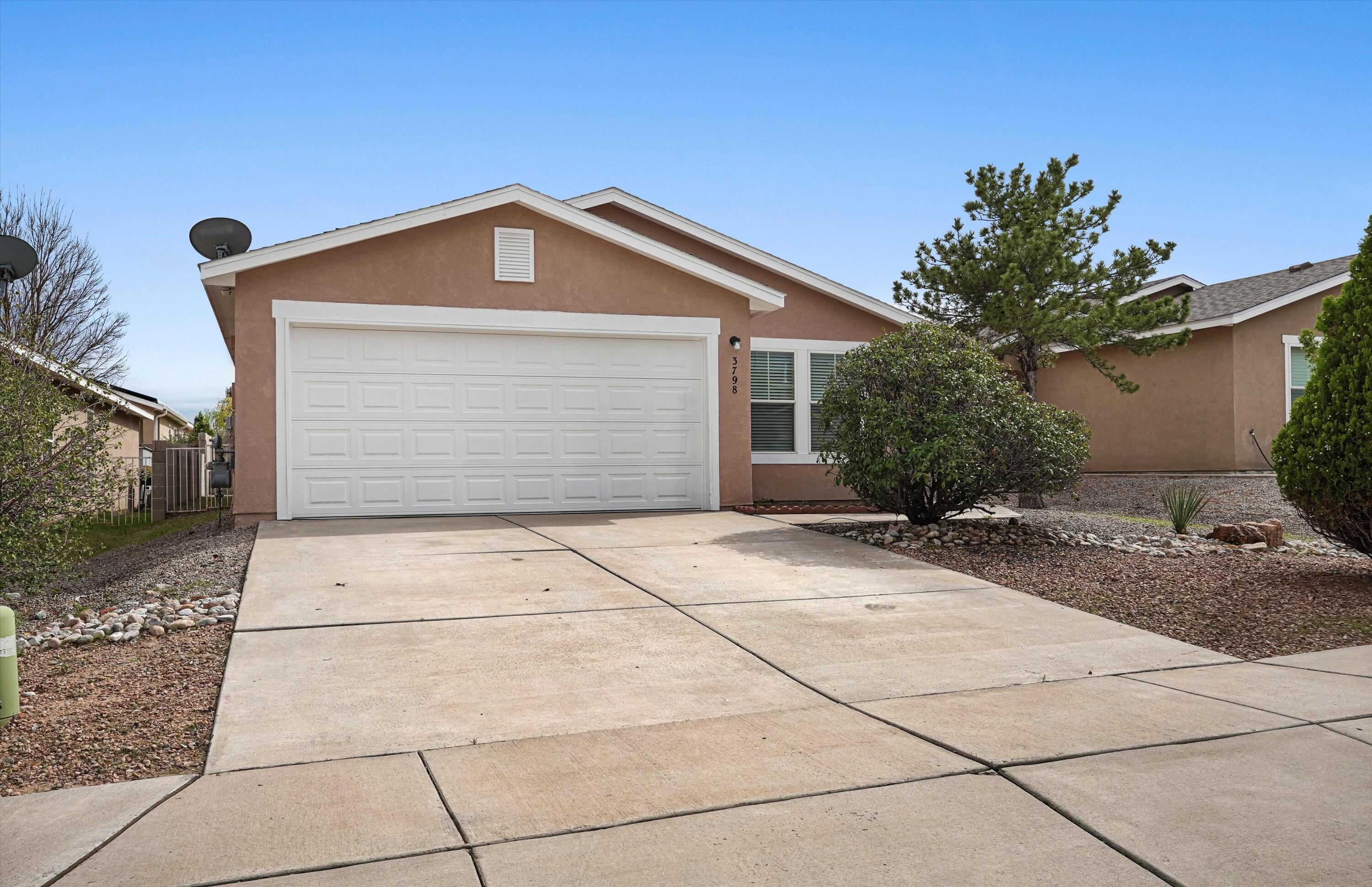 Experience comfortable living in this inviting 4-bedroom, 2-bath single-story home in Rio Rancho's High Range community. Offering approximately 1,673 square feet, the thoughtfully designed floor plan features a spacious living area, well-appointed kitchen with a full appliance package, and a private primary suite with a full bath. Refrigerated air provides year-round comfort, while tile and carpet flooring add warmth and practicality throughout. Step outside to a private walled backyard with an open patio, offering an ideal setting to relax or entertain. Complete with an attached 2-car garage and convenient access to schools, shopping, dining, and everyday amenities, this home presents an exceptional blend of space, comfort, and effortless living.