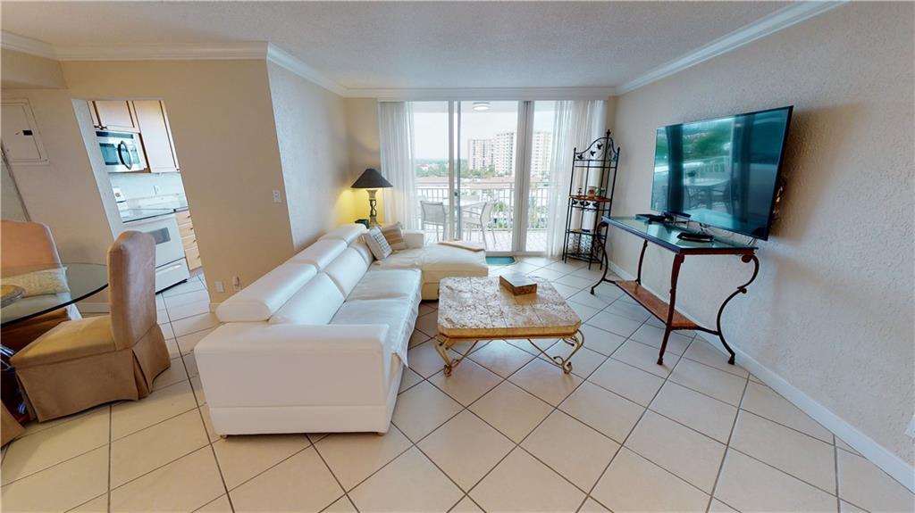 A PEEK AT THE KITCHEN FROM LIVING ROOM AND DINING ROOM AREAS