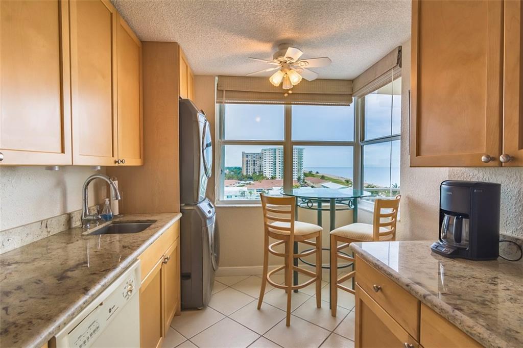 KITCHEN WITH DIRECT AND DISTANCE VIEW OF THE BEACH LOOKING NORTH AND EAST