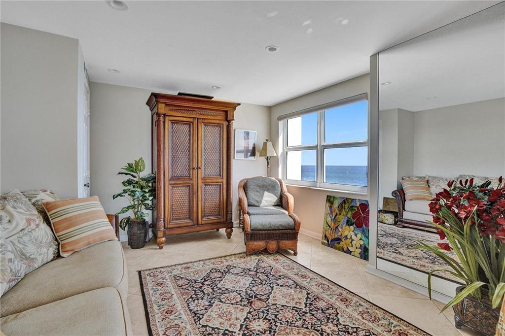 This room is located off of the living room: it is currently being used as a den. However, it has a closet, which would make it perfect as a 3rd bedroom. See photo #11 for french door entrance to this room.