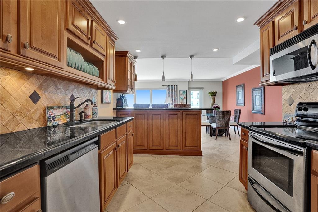 With your back to the kitchen door, facing into the apartment. All ceilings have been refinished, and there is recessed lighting and crown molding running thru out the apartment. The glass door leads out on to the balcony.