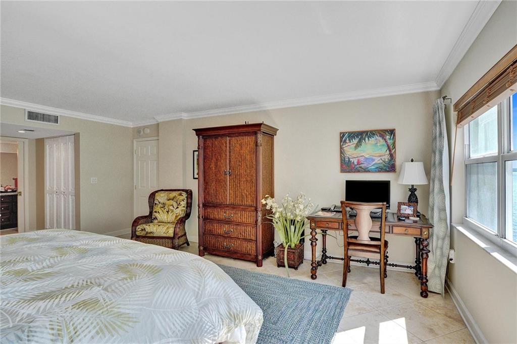 The primary bathroom is located to the left of the entry door. The other set of doors is a closet.