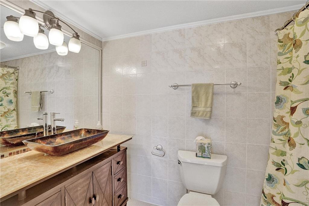 The second/guest bathroom is located right across form the second/guest bedroom.