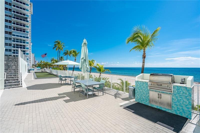 The lower promenade deck: one of the 2 barbeque grills, the bocce court, and the stairs that lead up to the tennis court. From here, you are only a few steps to the sand.
