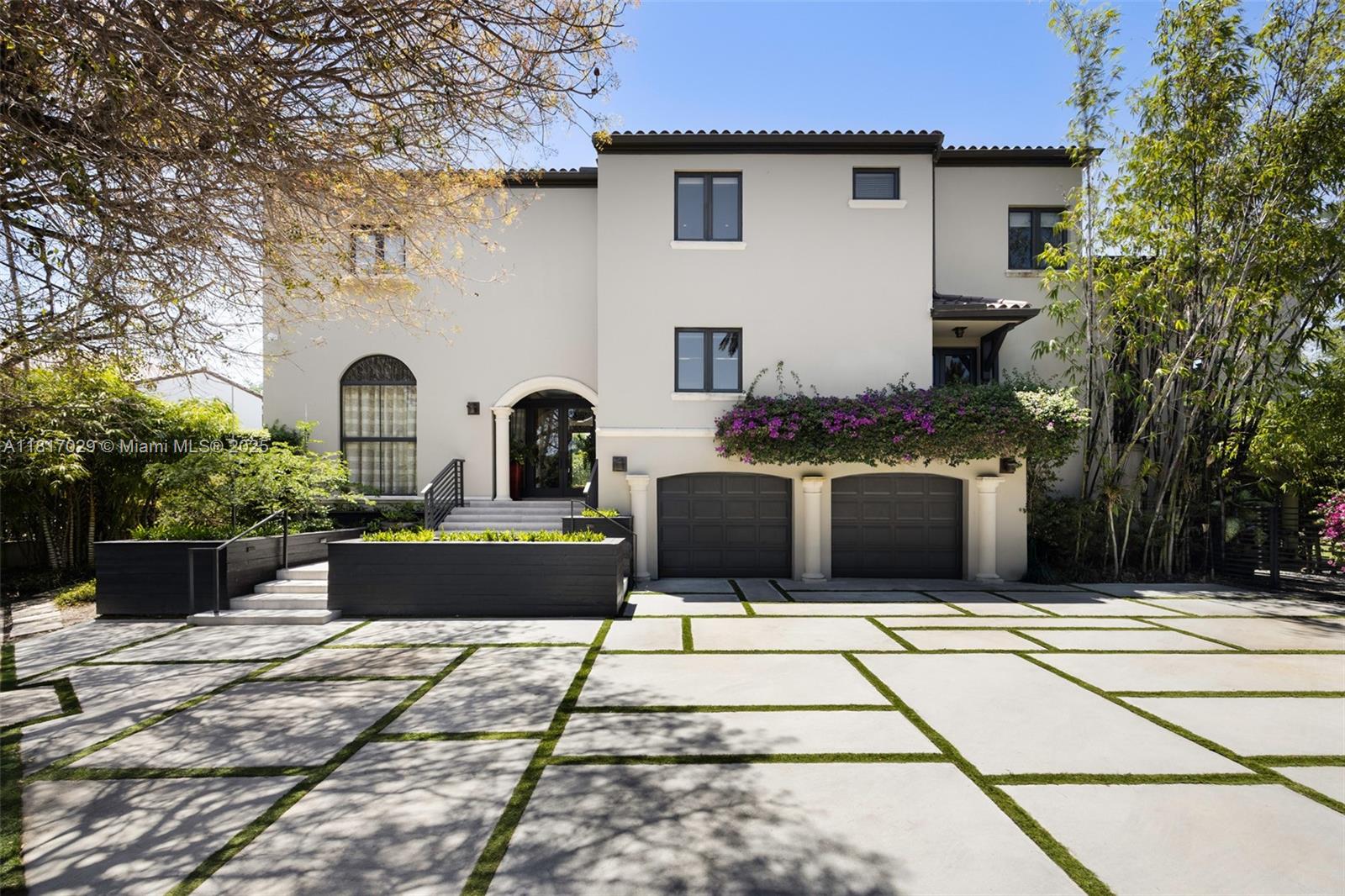 Refined elegance in exclusive guard-gated Cocoplum. Located on a quiet cul-de-sac. Fully Remodeled 6-bed, 4.5-bath residence for grand entertaining & serene family living. Formal living & dining rooms, office/den, spacious bedrooms, marble bathrooms, and a warm family room with dramatic cathedral-ceiling and French doors opening to cozy terrace. Ground-level bonuses: staff quarters with en-suite bath, cabana bath & music studio. Pool, impact glass throughout, new roof (2024). Every detail has been carefully curated. Gourmet kitchen boasts 3 Viking ovens, 2 Miele dishwashers, Thermador wine cellar, and bright breakfast area. Defining feature is elegant custom woodwork—from oak floors to office’s exotic rosewood wall paneling. A luxurious, private sanctuary in one of Coral Gables’ most desirable neighborhoods.