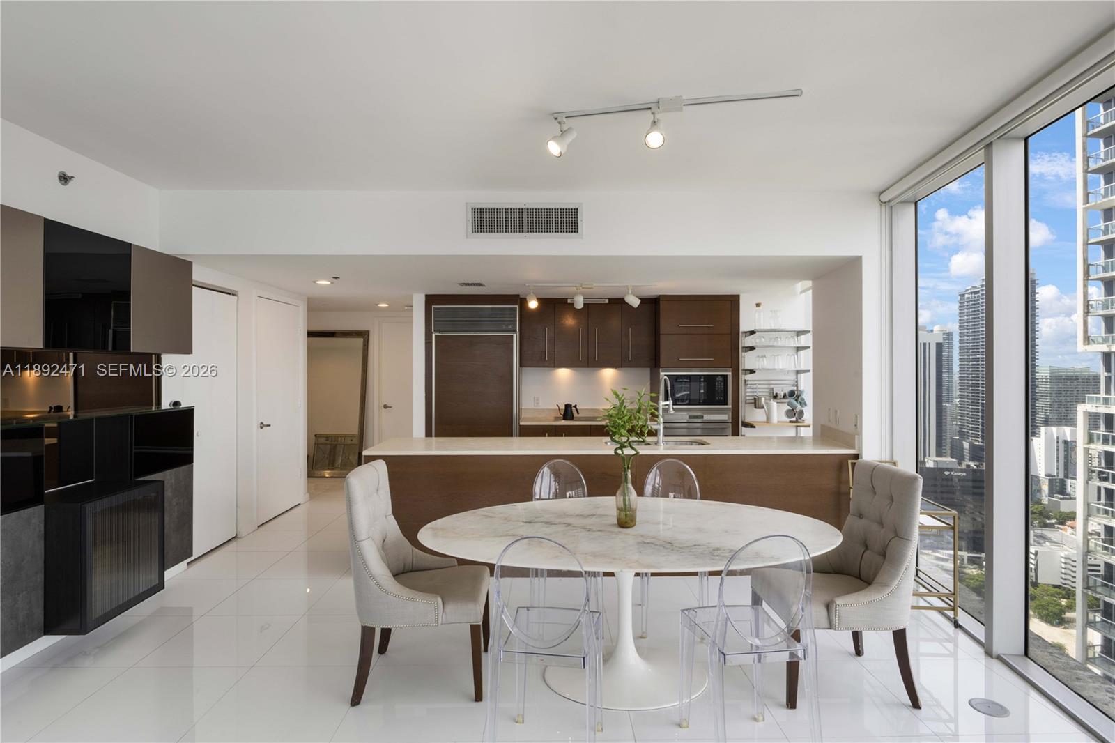 Situated in the renowned Icon Brickell—one of Miami’s most coveted addresses—this corner residence captures panoramic views of the city, river, and Biscayne Bay. Floor-to-ceiling glass surrounds the home in natural light. The spacious split floor plan offers two ensuites for maximum privacy and comfort, while the open-concept living area flows seamlessly to a large balcony overlooking the skyline. A sleek European-style kitchen features Sub-Zero and Wolf appliances and glossy porcelain floors, blending style and function effortlessly. Residents of Icon Brickell enjoy access to world-class amenities, including a luxury spa, state-of-the-art fitness center, expansive pool deck with fine dining and private cabanas, and five-star service in the heart of Brickell.