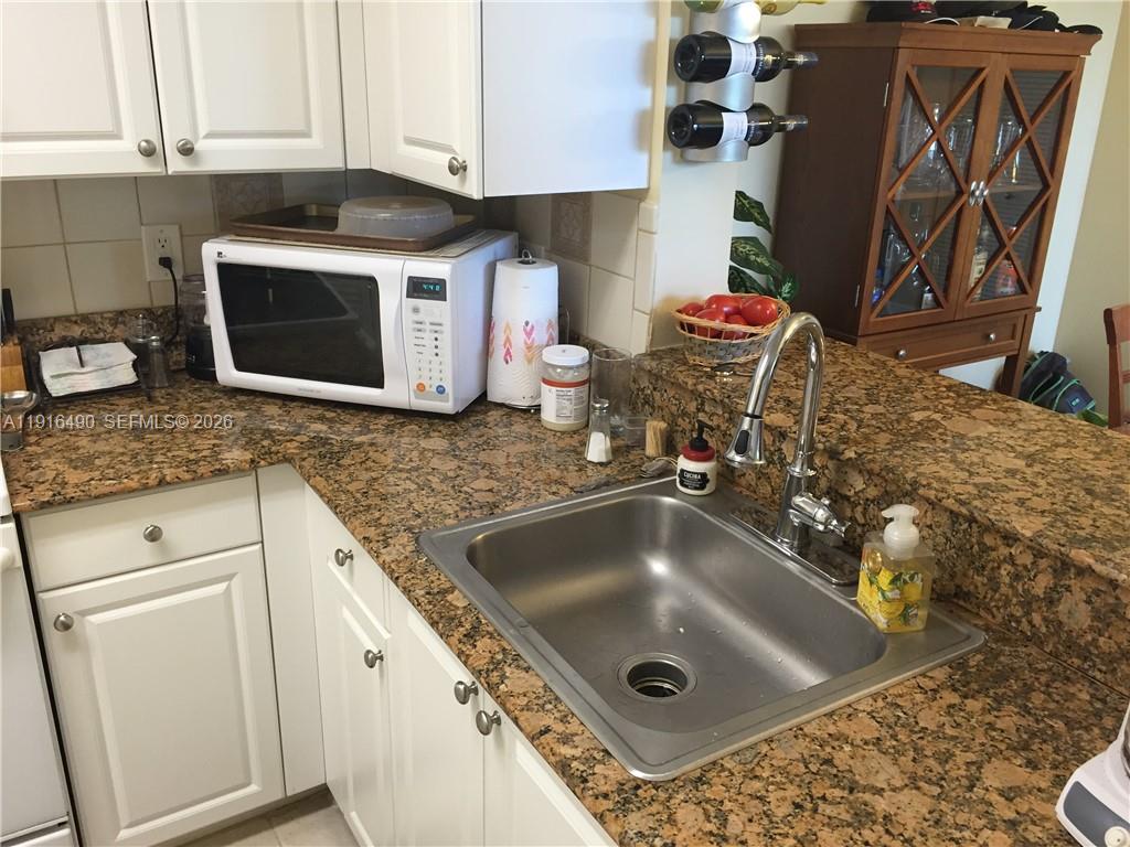 Modern kitchen with designer features at 1341 3rd Ave - Condo in Dania Beach