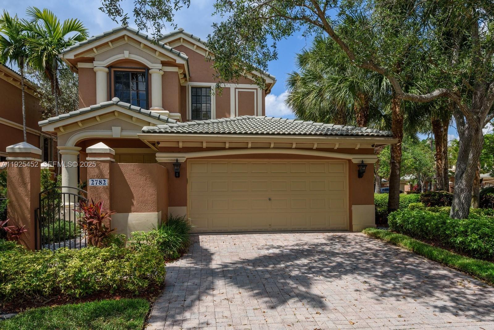 Make this stunning corner-unit Coach Home your dream residence, located in the prestigious gated community of Legends at Weston Hills Country Club. This elegant home features marble flooring throughout, a private elevator, and refined tray ceiling in main bedroom that enhance its spacious design. Enjoy fully custom-built closets, beautiful wooden shutters, and hurricane shutters for added comfort and security. The property is equipped with a German tankless water heater that services the entire home, an anti-scale water filtration system, and LG stainless steel appliances, combining luxury, efficiency, and peace of mind in one exceptional home.