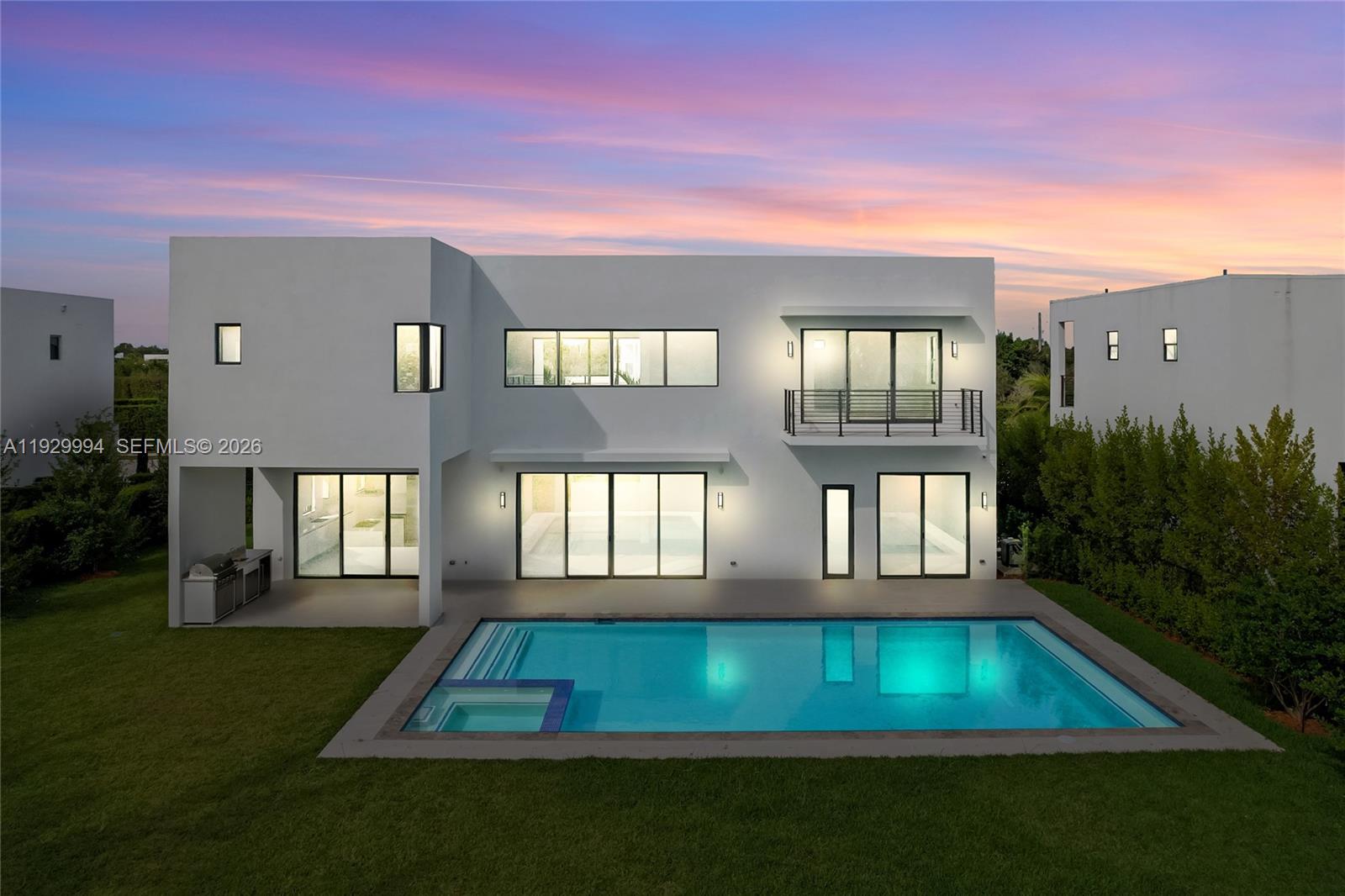 Stunning brand new two-story lagoon front house located in the exclusive community of Botaniko.It features 5 bedrooms, 5 bathrooms, a powder room, an attached 3-car garage, a huge backyard with a private pool with jacuzzi, and a summer kitchen. Be the first to live in this modern masterpiece designed by world renowned architect Mateu. Built in 2025, the house was just delivered by developer in December and boasts 3,810 Sq Ft of living space over a huge lot spanning 15,933 Sq Ft. The designer kitchen features top-of-the-line appliances (Sub-zero, Wolf, Asko). Enjoy luxurious high ceilings and expansive windows, which provide abundant natural light and a seamless indoor-outdoor flow. The beautiful back yard offers lush landscaping, an oversized pool, and a beautiful lagoon view. The residence has extra upgrades such as 3-zone integrated sound system and security cameras. Botaniko Weston is located right in front of Bonaventure golf club, near top-rated schools, restaurants and shops.