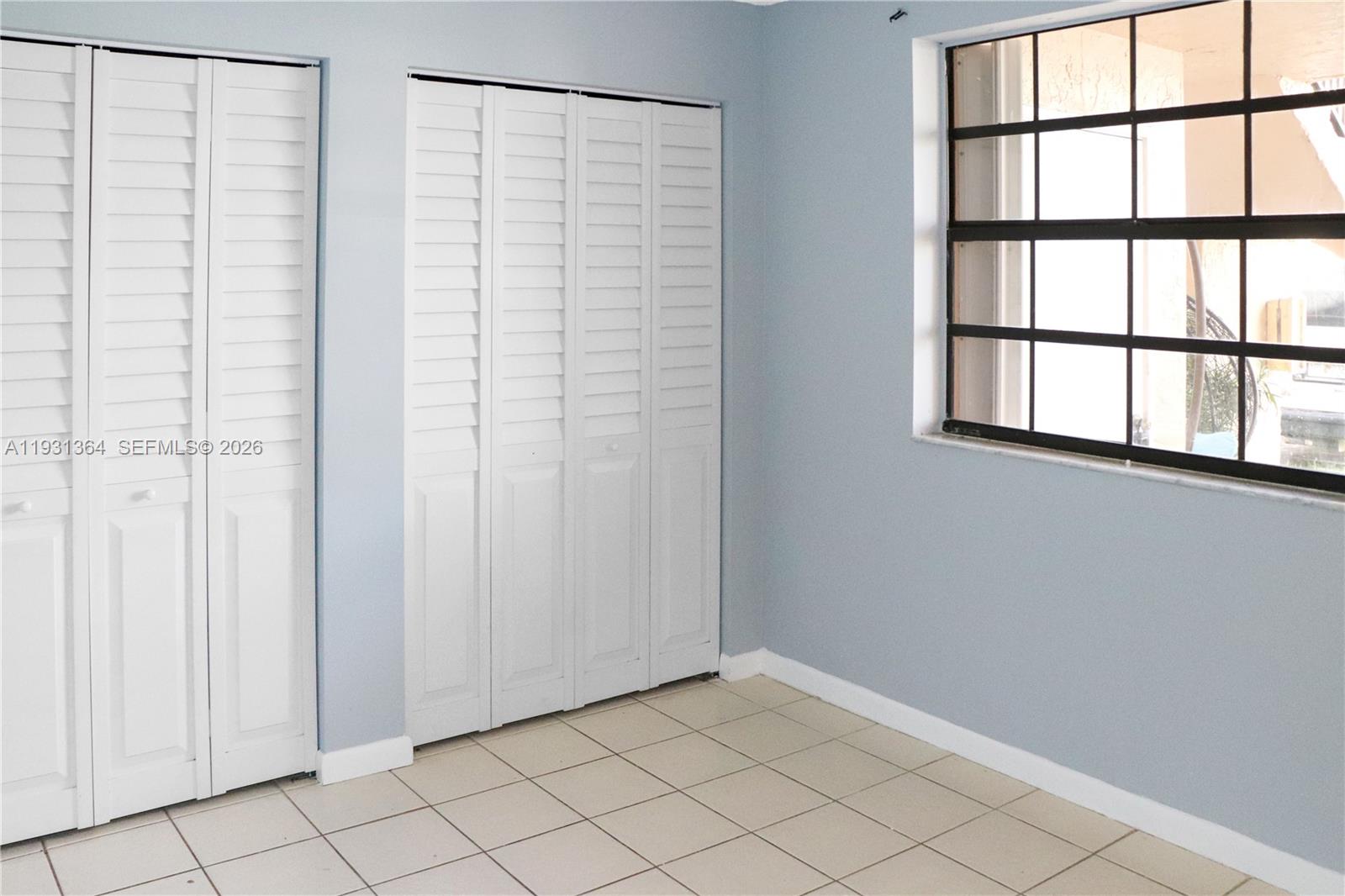 Spacious living room with panoramic views at 1080 Franklin Ave - Condo in Homestead