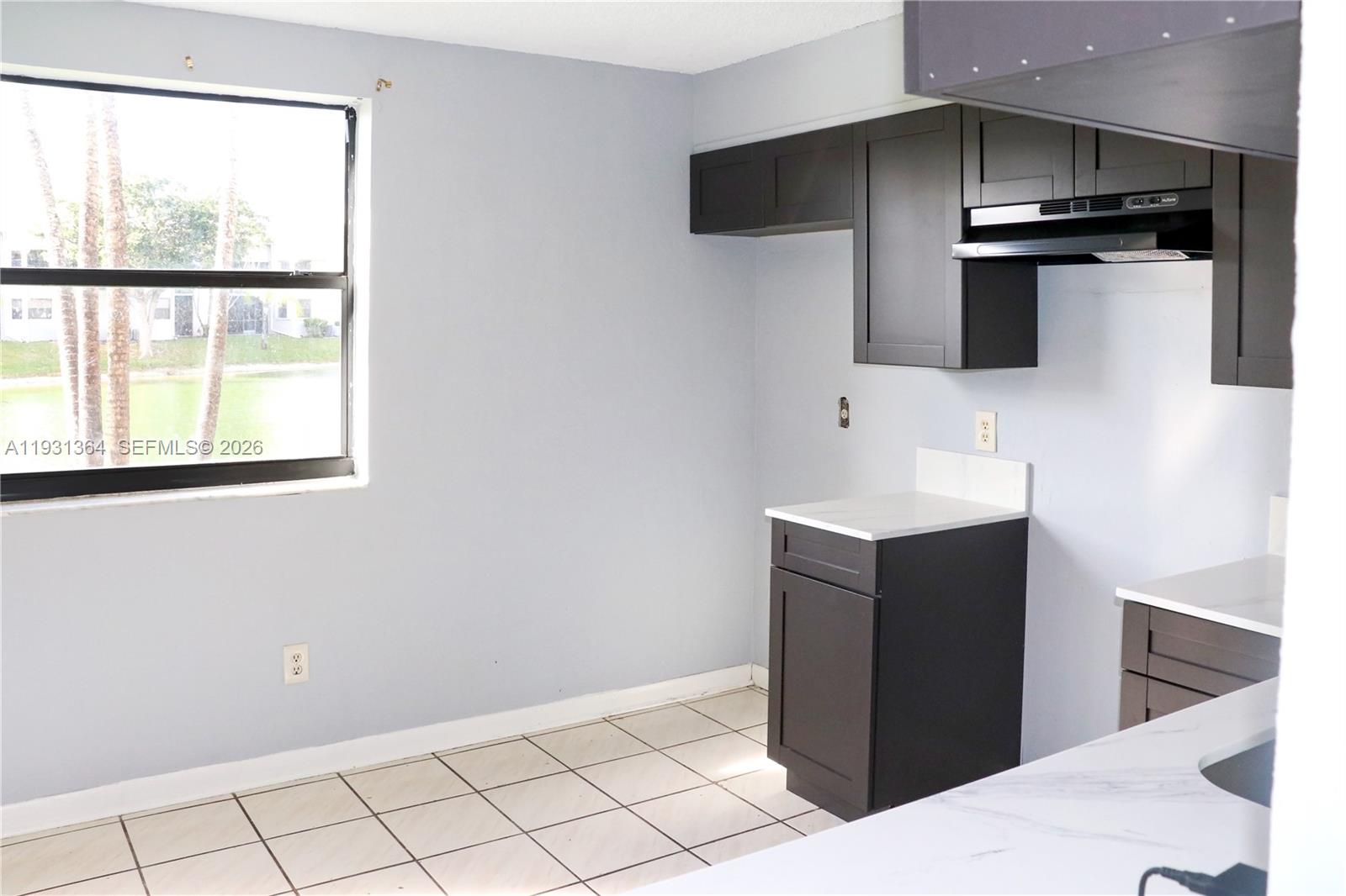 Spacious living room with panoramic views at 1080 Franklin Ave - Condo in Homestead
