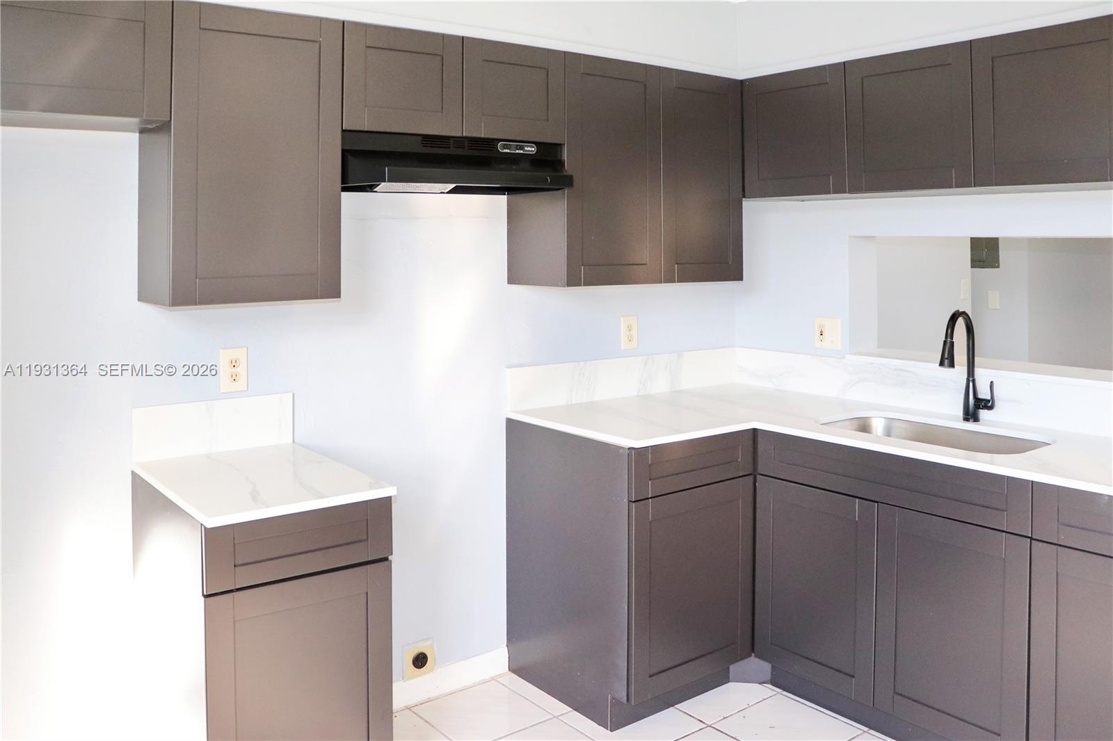 Modern kitchen with designer features at 1080 Franklin Ave - Condo in Homestead