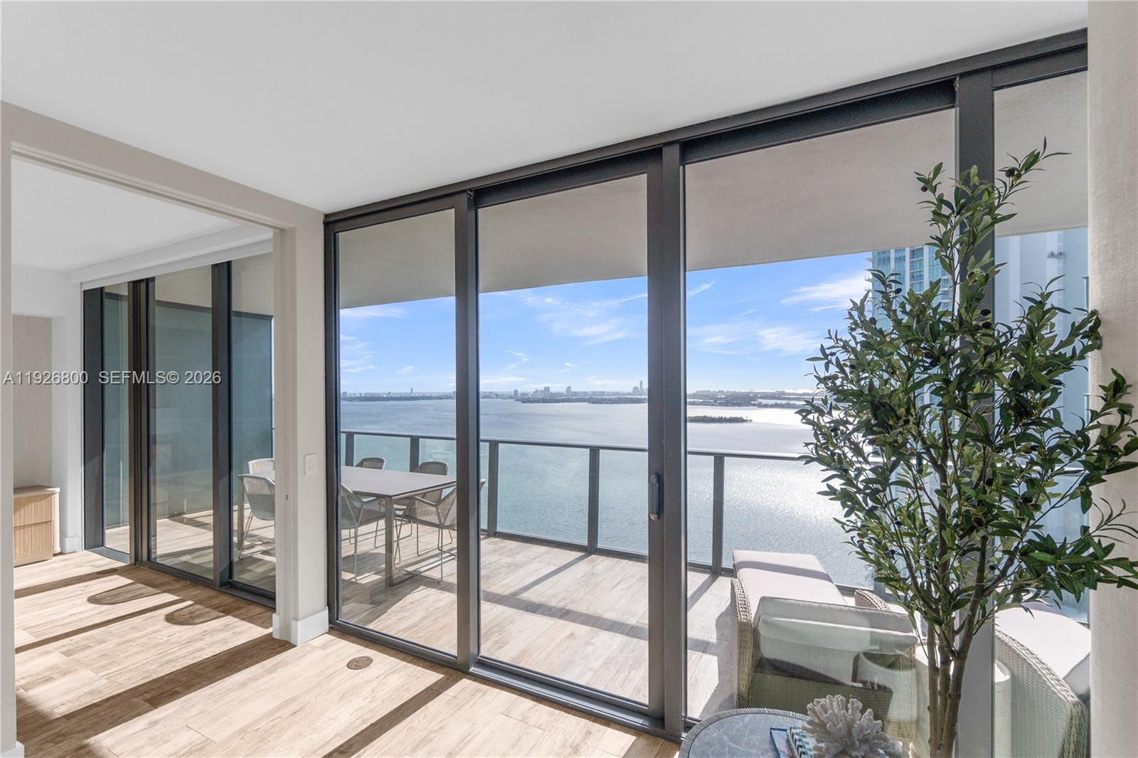Direct ocean and bay views: this remarkably renovated residence offers sophisticated living in the heart of Edgewater. Set above the vibrant city, it presents panoramic views of Biscayne Bay, Miami Beach, and the Miami skyline. Boasting 9-foot ceilings and an open layout, this home has been meticulously redesigned with custom high-end finishes throughout. A private elevator opens into a newly designed, elegant foyer, leading to an impeccably updated kitchen—complete with top-of-the-line appliances, sleek cabinetry, and sophisticated countertops. Two generously sized primary suites open directly to a private balcony, providing sweeping views of both sunrise and sunset. Each of the four bedrooms features luxurious en suite bathrooms with a custom vanities, designed closet space to ensure ample organization and comfort, and an abundance of natural light. Every detail of this home has been carefully considered, creating a spacious & sophisticated living experience. Set in an ultra luxury building with top-tier amenities including a spa, pool, bowling alley, wine tasting room, cigar lounge, and private theater.  This home combines privacy and comfort, still, with easy access to the airport, restaurants, and shopping.  The building is located next to a dog park, and is walking distance to Design District, Midtown and Wynwood.  This is the place to be.  Furniture can be negotiated for a move-in ready option.