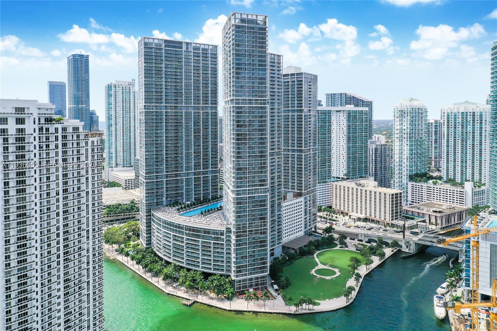 Rising high on the 52nd floor, this 2-bedroom residence with a spacious den offers views of Biscayne Bay, Brickell Key, and the Miami skyline from every room. This highly sought-after line in the building features abundant natural light and a flexible layout. The den works perfectly as an office, TV lounge, or additional sleeping area. The gourmet kitchen includes premium Miele and Sub-Zero appliances, sleek cabinetry, and stone countertops. Located within Icon Brickell, residents enjoy resort-style amenities including a world-class spa and wellness center, state-of-the-art fitness facilities, multiple social lounges, and a redesigned pool deck overlooking the bay with cabanas, hot tubs, and an infinity-edge pool. Additional conveniences include on-site dining options, a poolside café, game room, 24-hour concierge, and valet services.