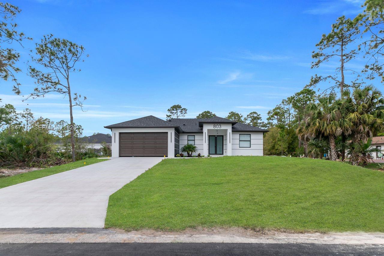 Open-concept living area at 803 Desoto Ave - Home in Lehigh Acres
