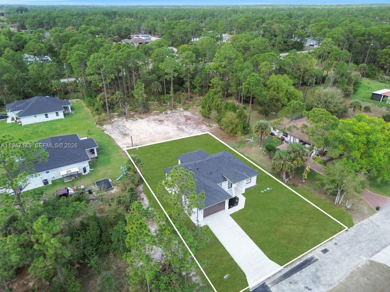 Open-concept living area at 803 Desoto Ave - Home in Lehigh Acres