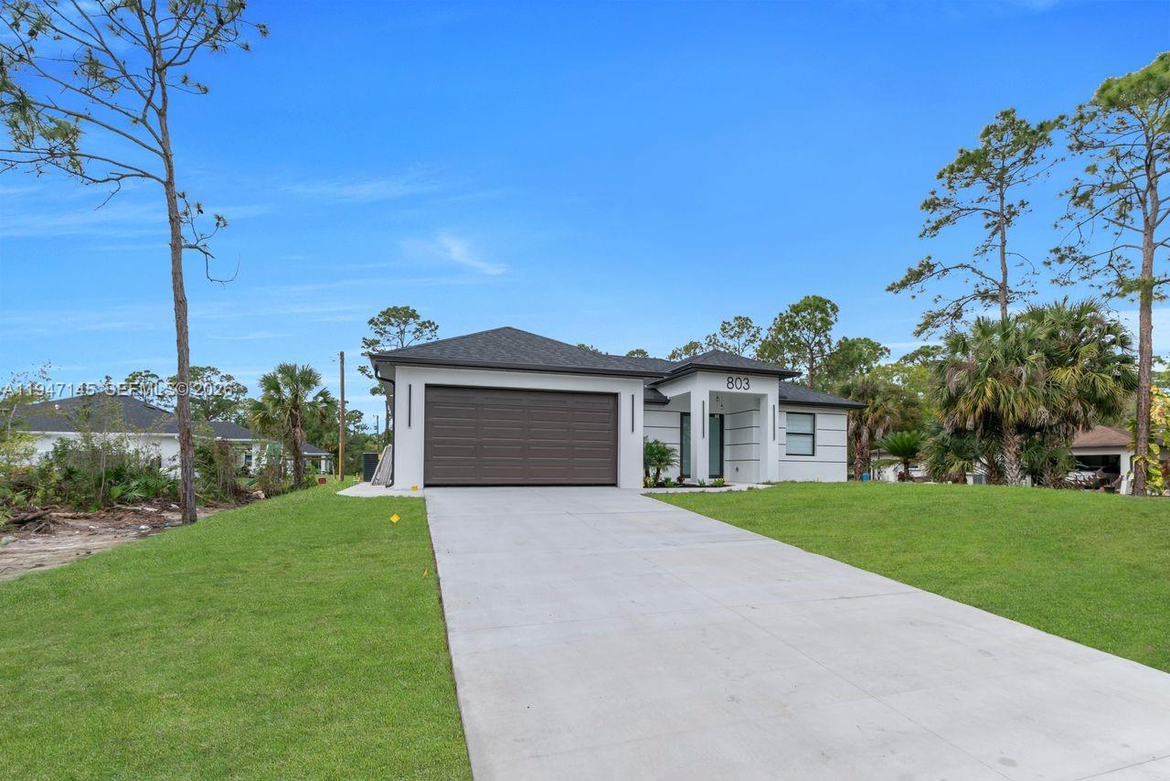 Modern kitchen with designer features at 803 Desoto Ave - Home in Lehigh Acres