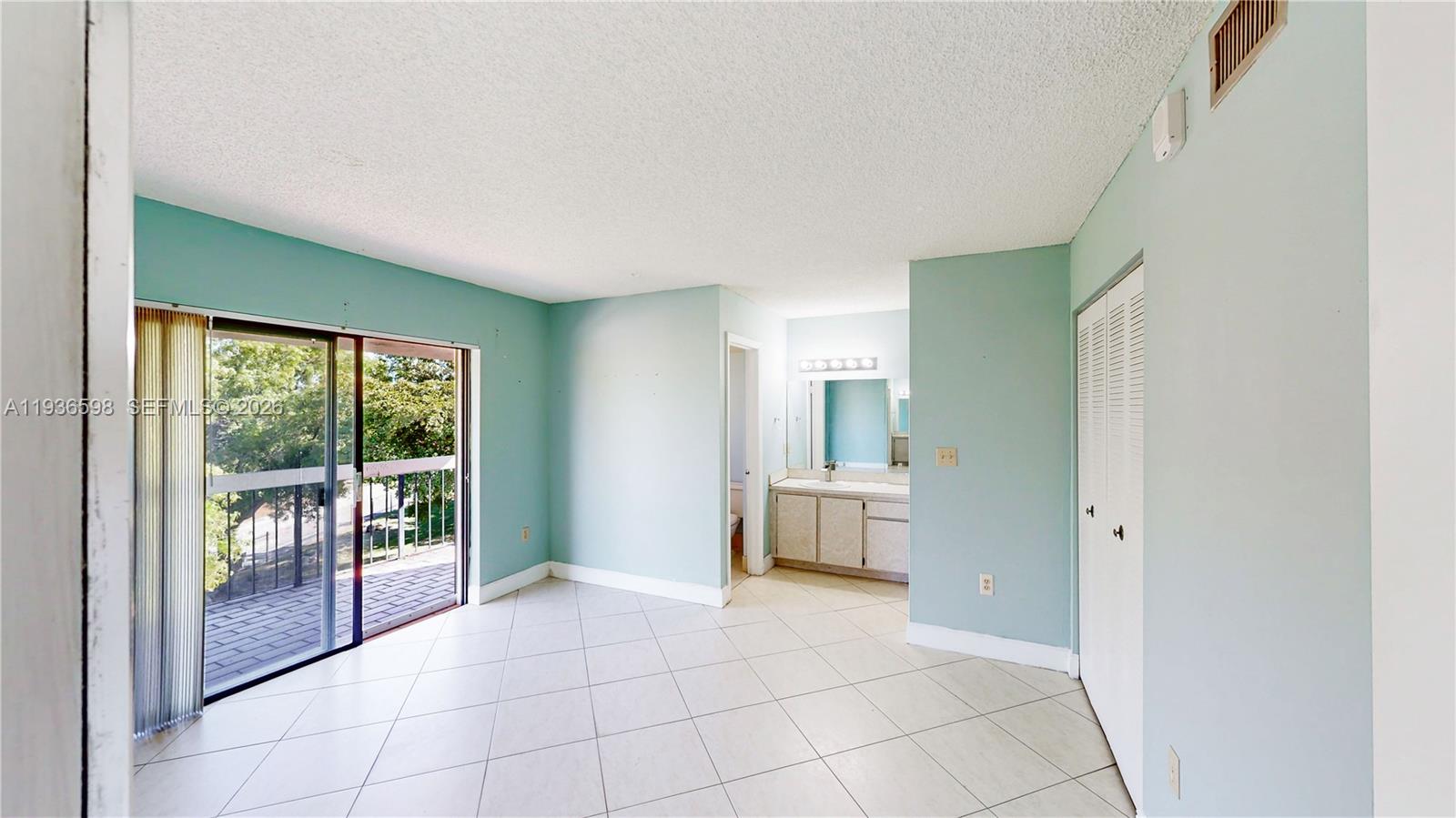 Spacious living room with panoramic views at 1300 122nd Ave - Condo in Miami